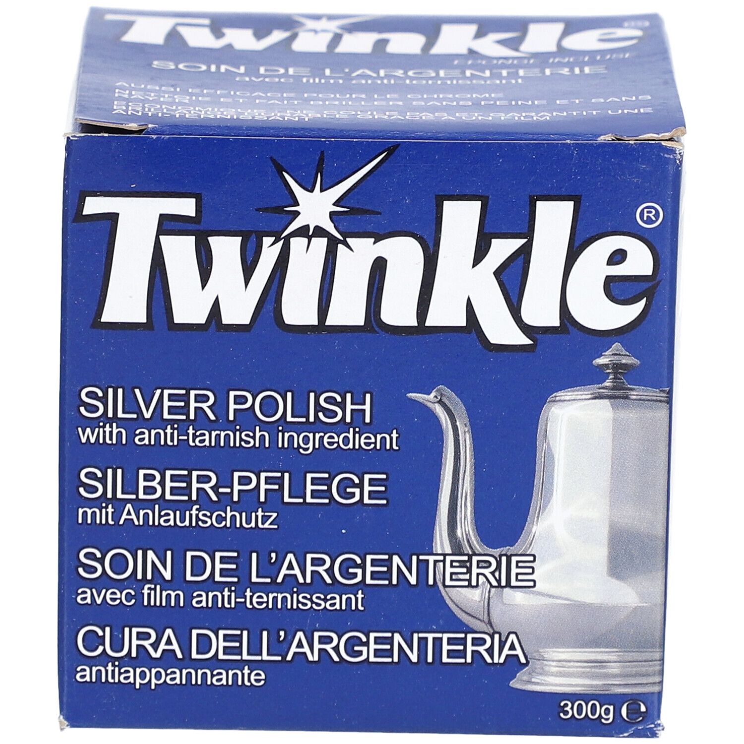 Boîte bleue avec logo "Twinkle" et nom du produit. Contient du polish argent avec protection anti-ternissement. Image d'une cafetière.