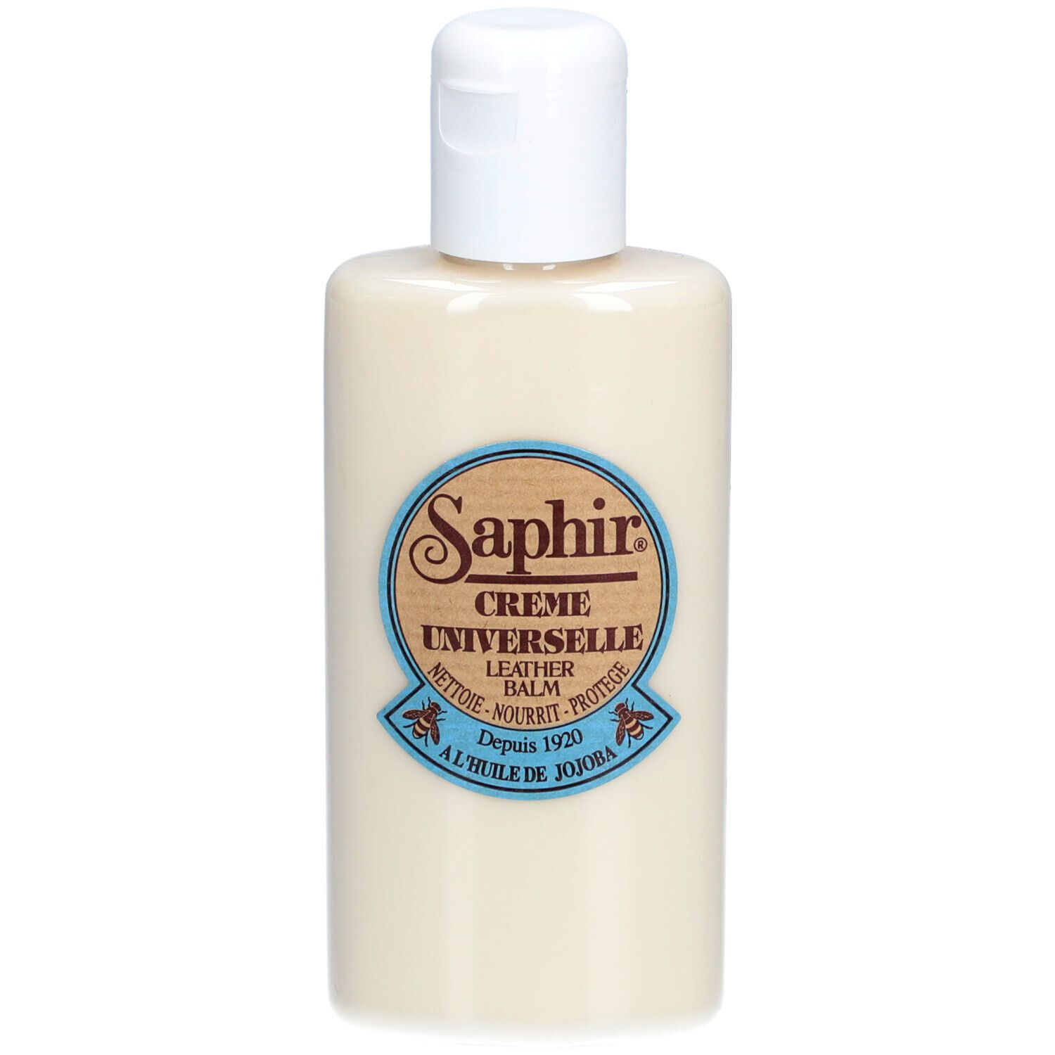 Flacon beige avec bouchon blanc. Étiquette "Saphir Crème Universelle". Bordure bleue.