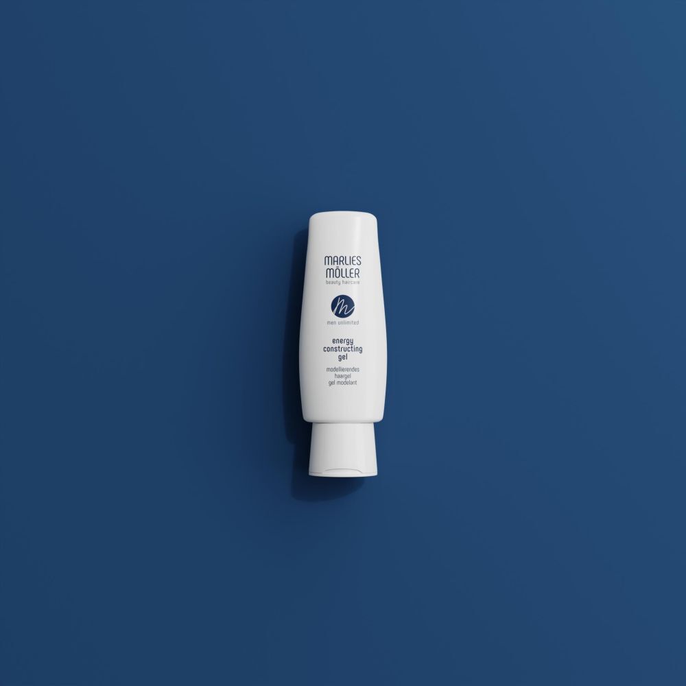 Flacon de gel capillaire blanc sur fond bleu. Inscription: Marlies Möller, Men Unlimited, Energy Constructing Gel.