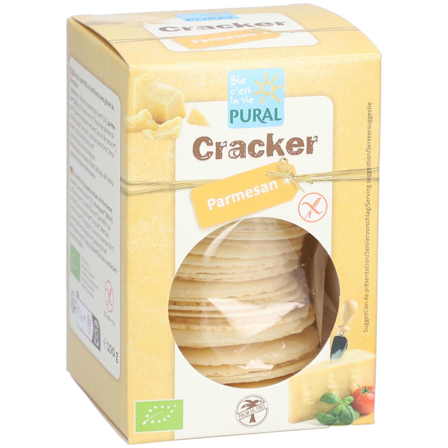 Boîte jaune "PURAL Cracker Parmesan". Fenêtre ronde montrant des crackers. Labels bio et sans gluten.