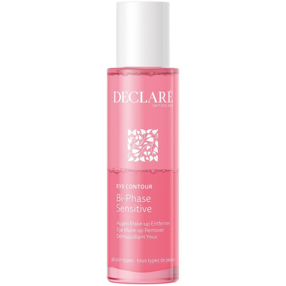 Liquide rose dans un flacon cylindrique à bouchon blanc. Inscription DECLARÉ et nom du produit.