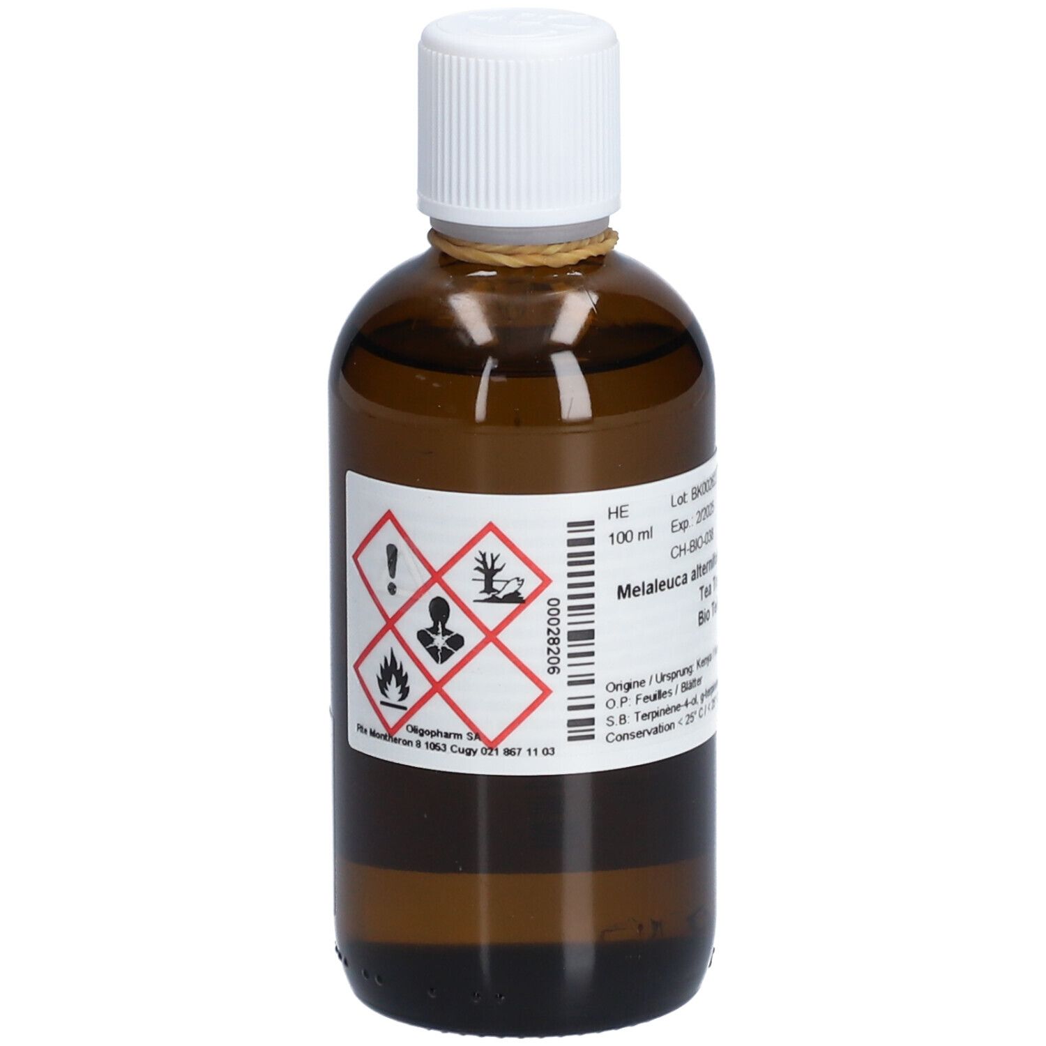 Flacon en verre brun avec bouchon blanc. Étiquette avec symboles de danger. Inscription: Melaleuca alternifolia. Informations produit.