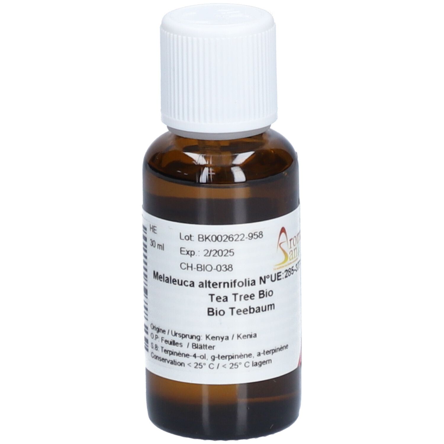 Flacon en verre brun avec bouchon blanc. Étiquette avec texte: Melaleuca alternifolia, Tea Tree Bio, Bio Teebaum. 30 ml.