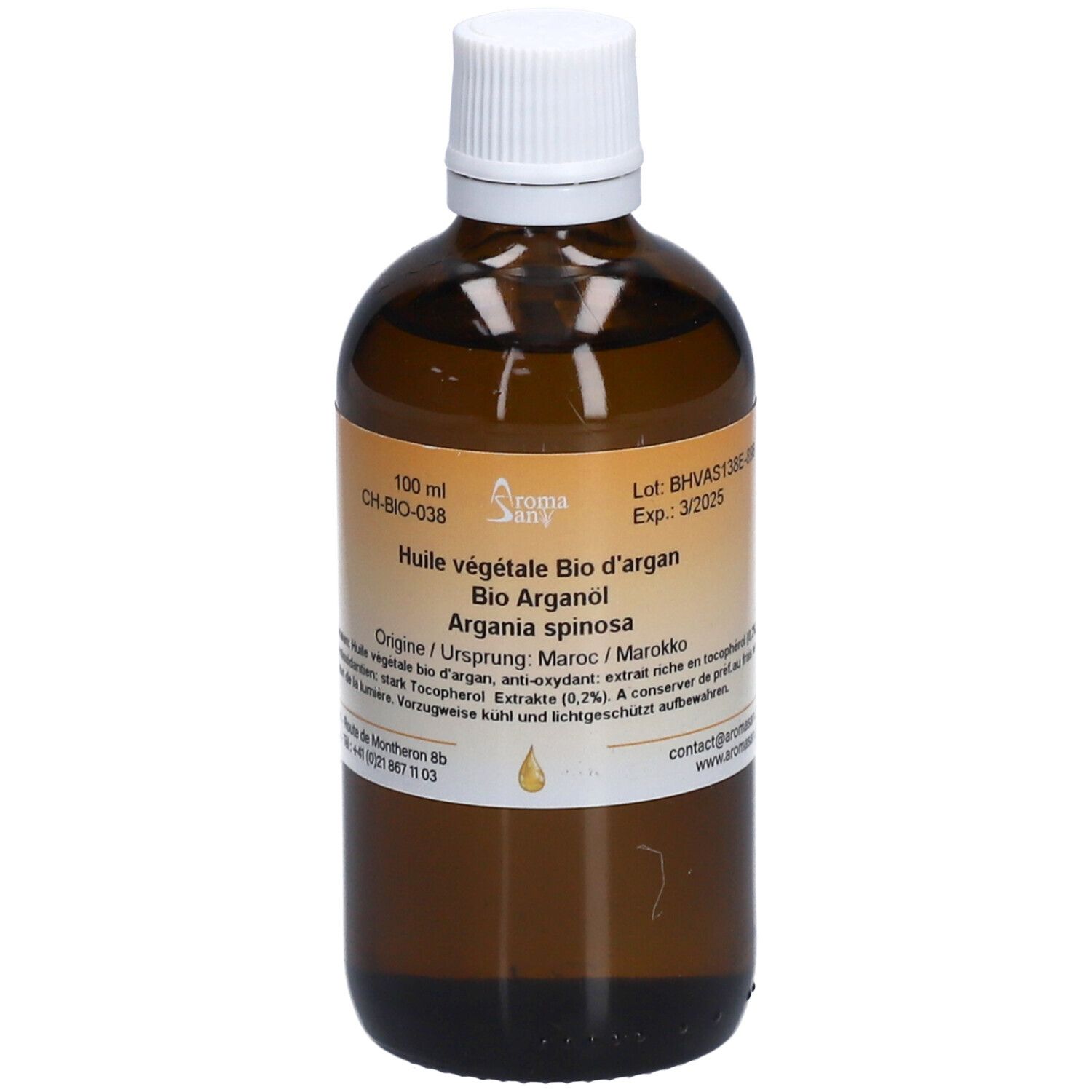 Flacon en verre brun avec bouchon blanc. Étiquette avec informations produit. Inscription: Huile végétale Bio d'argan.
