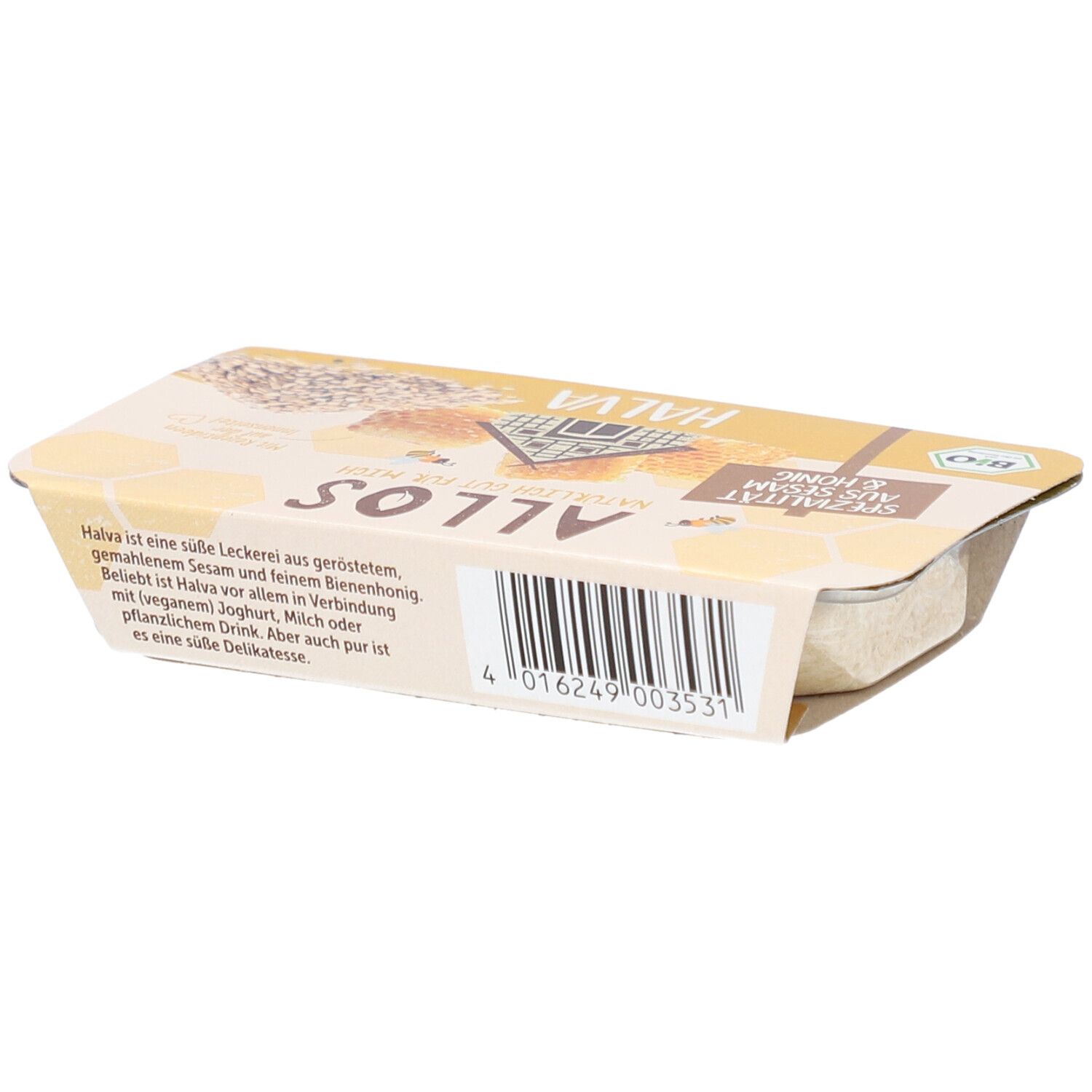 Emballage de halva. Emballage jaune avec l'inscription "Spécialité au sésame et au miel". Label bio. Texte.