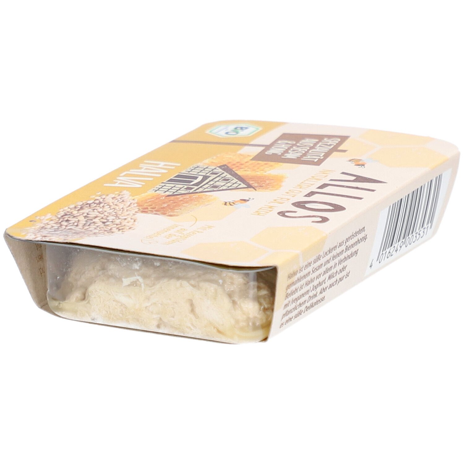 Emballage de halva. Emballage jaune avec l'inscription "Spécialité au sésame et au miel". Label bio.