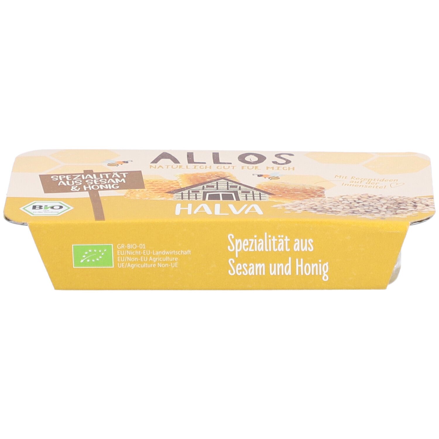 Emballage de halva. Emballage jaune avec l'inscription "Spécialité au sésame et au miel". Label bio.