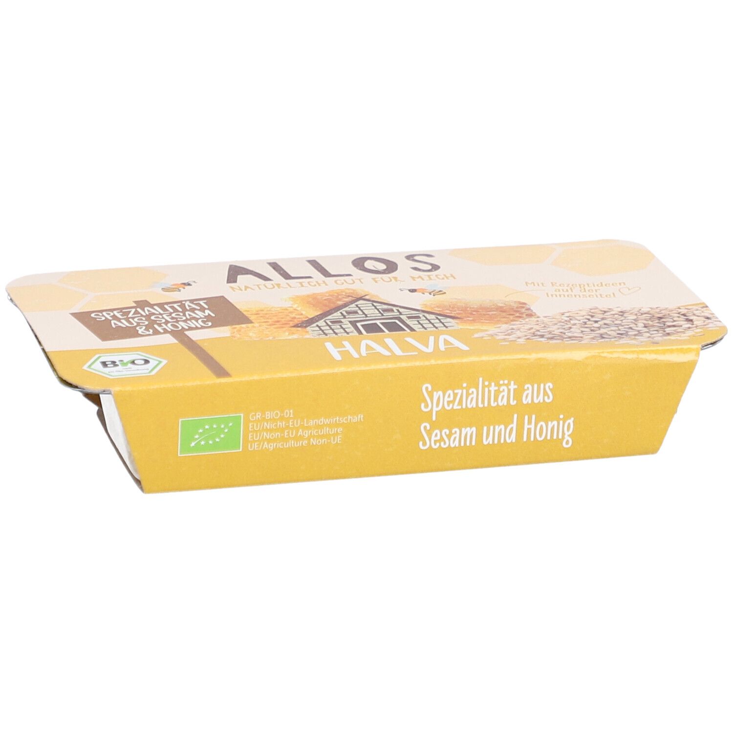 Emballage de halva. Emballage jaune avec l'inscription "Spécialité au sésame et au miel". Label bio.