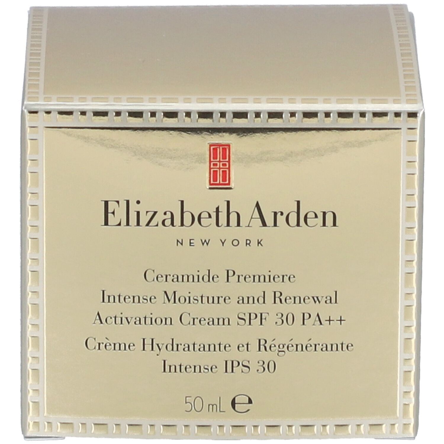 Pot doré avec couvercle. Inscription sur le couvercle. Anneau à motifs carrés. Produit cosmétique.