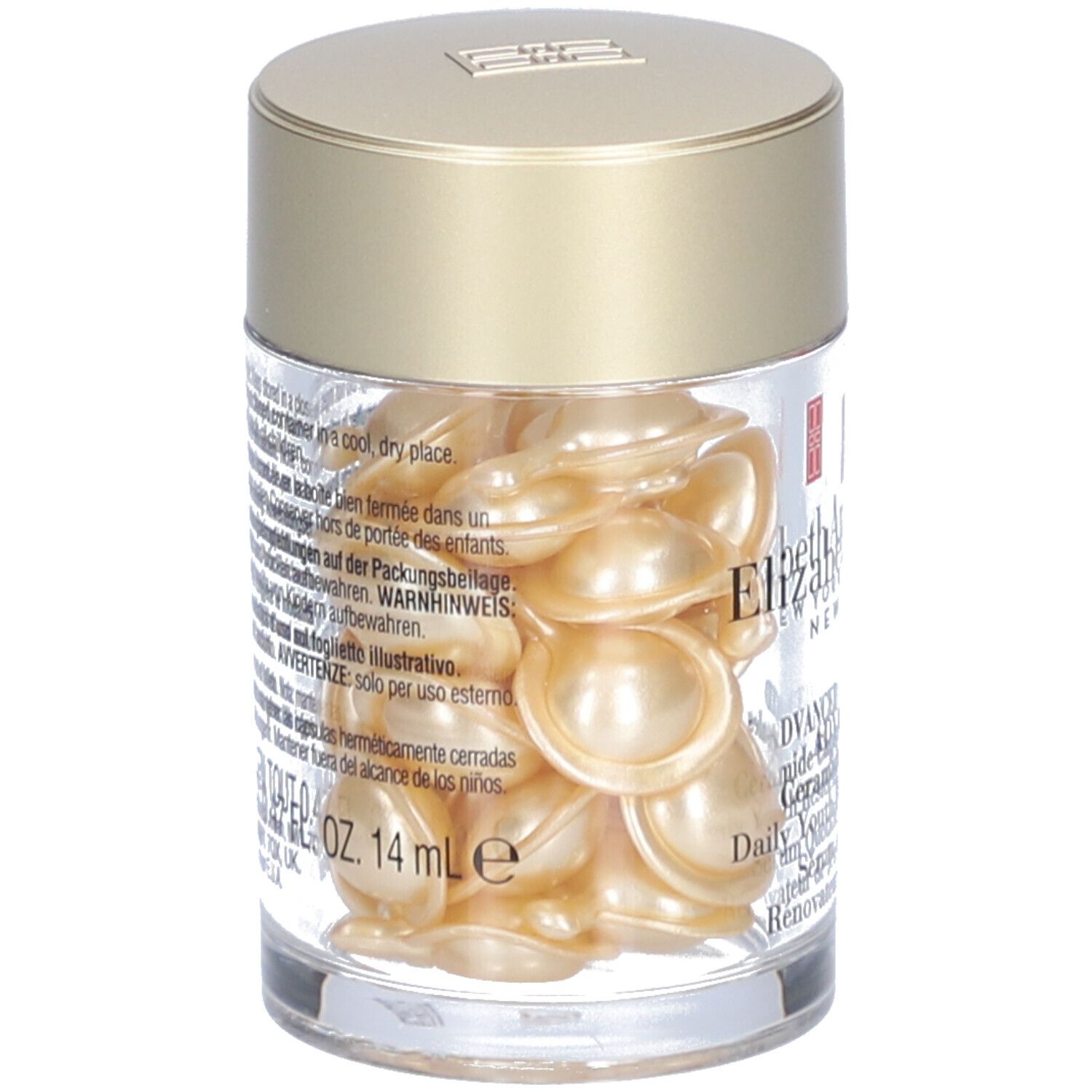 Récipient transparent avec capsules dorées. Texte sur l'étiquette, dont 14 ml.