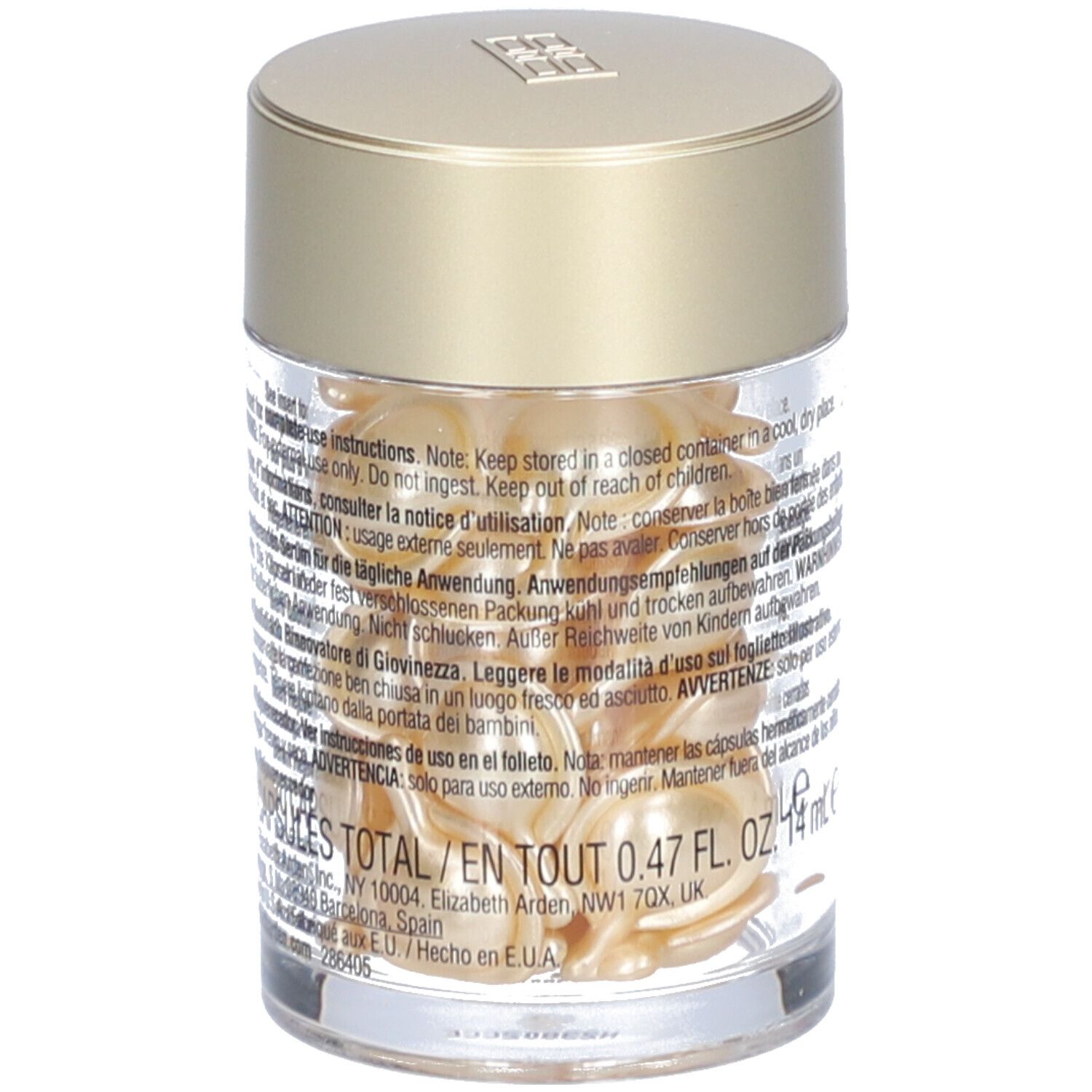 Récipient transparent avec capsules dorées. Texte sur l'étiquette, dont 0,47 FL. OZ.