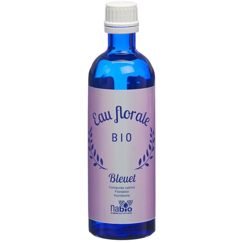 Flacon en verre bleu avec bouchon blanc. Étiquette "Eau florale BIO" et "Bleuet". Marque : nabio.