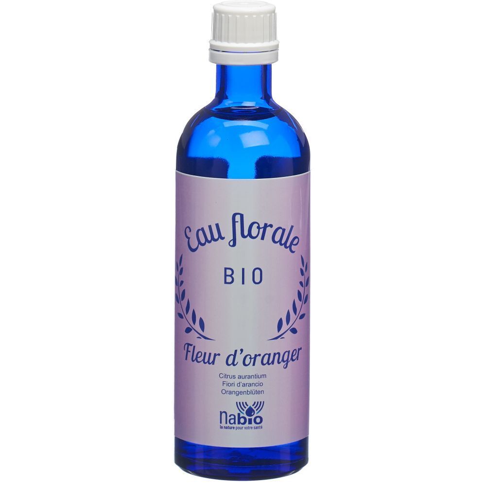 Flacon en verre bleu avec bouchon blanc. Étiquette "Eau florale BIO Fleur d'oranger".