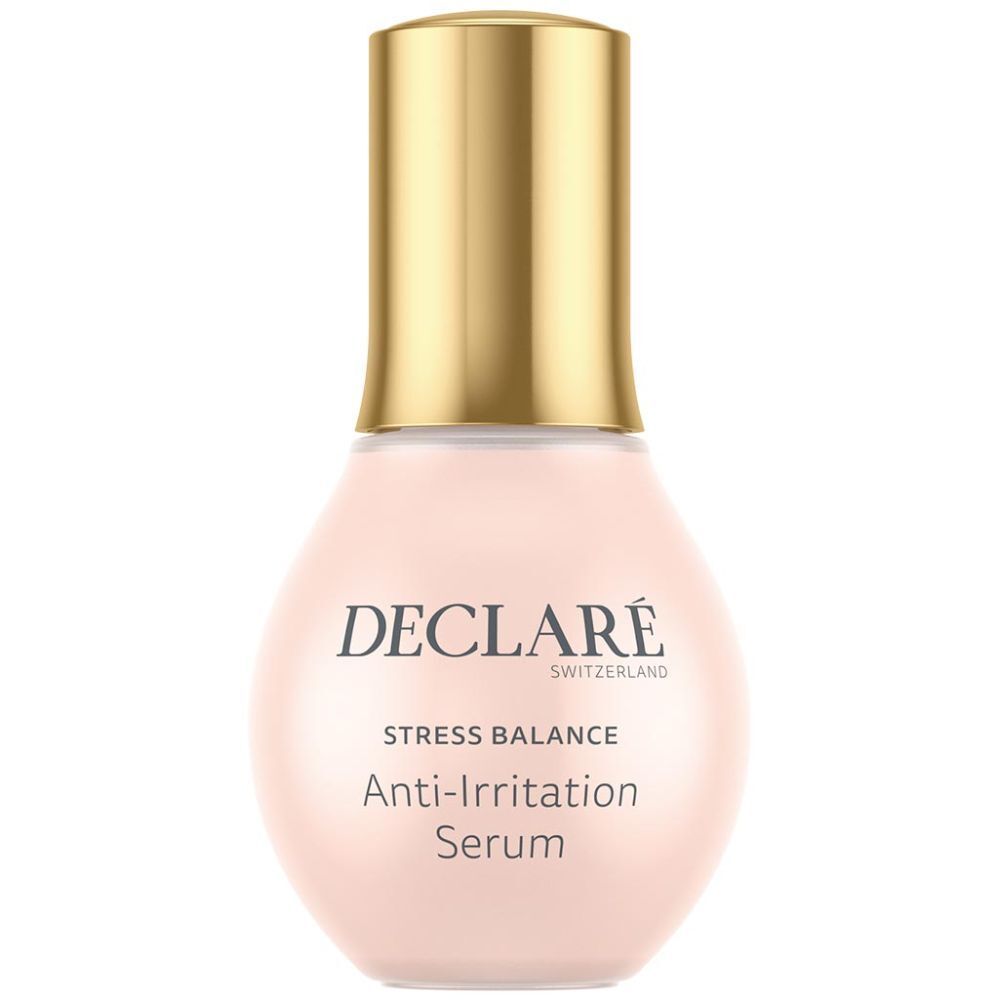 Flacon de sérum rose avec bouchon doré. Inscription : DECLARÉ, Stress Balance, Anti-Irritation Serum.