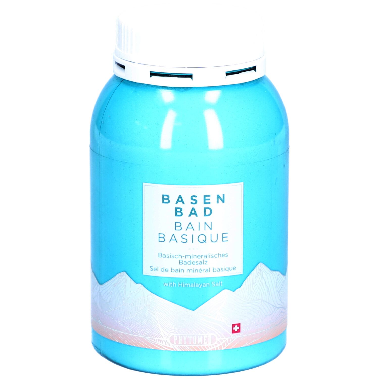 Boîte turquoise avec couvercle blanc. Inscription: BASEN BAD, BAIN BASIQUE. Croix suisse. Motif montagne.