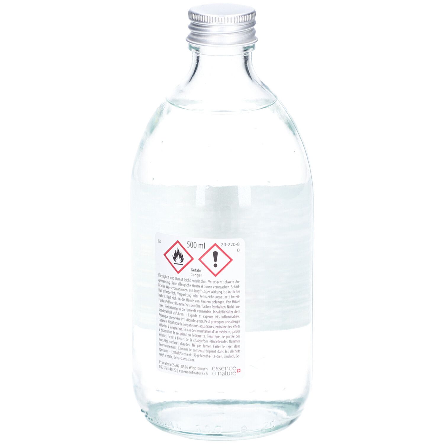 Flacon en verre avec bouchon argenté. Dos avec étiquette et avertissements. 500 ml.