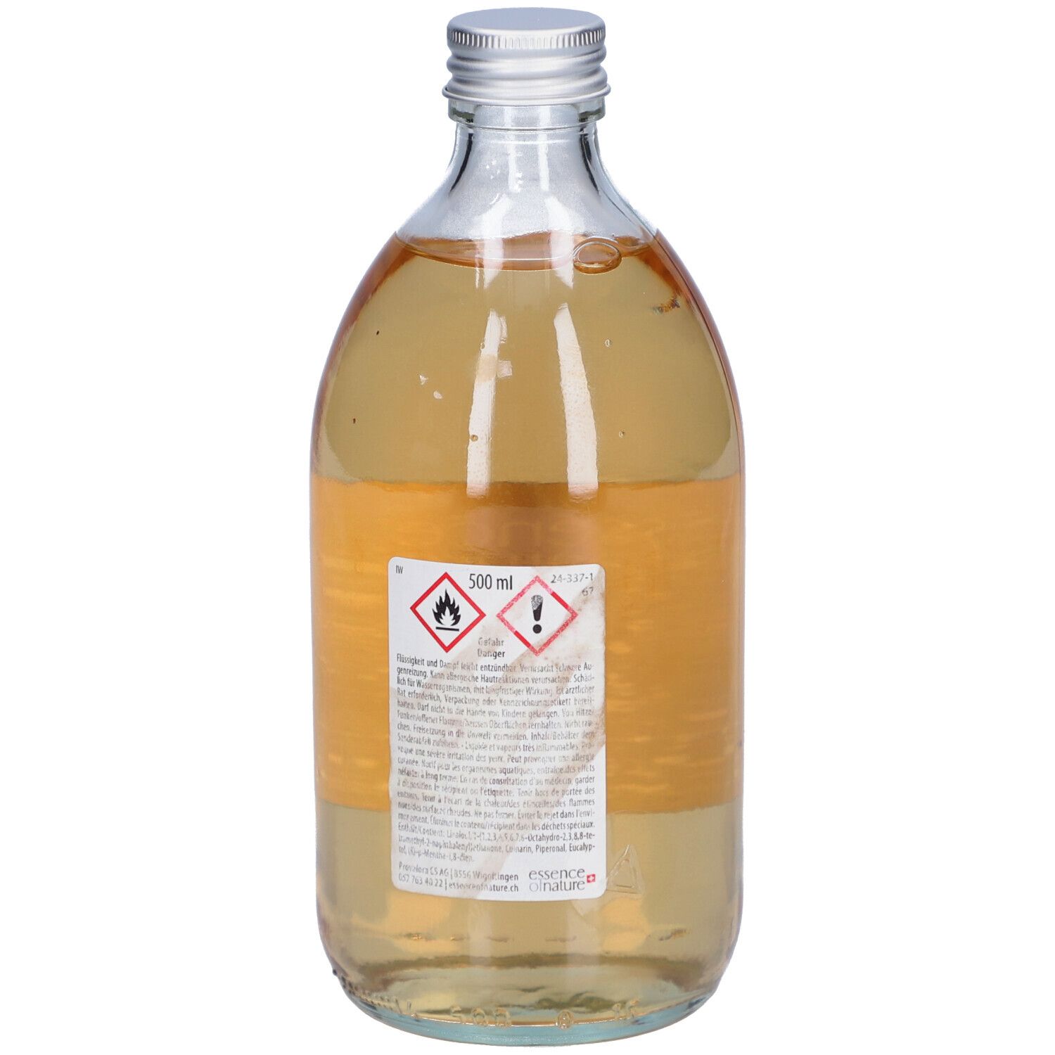 Flacon en verre avec bouchon argenté. Dos avec étiquette et avertissements. Liquide.