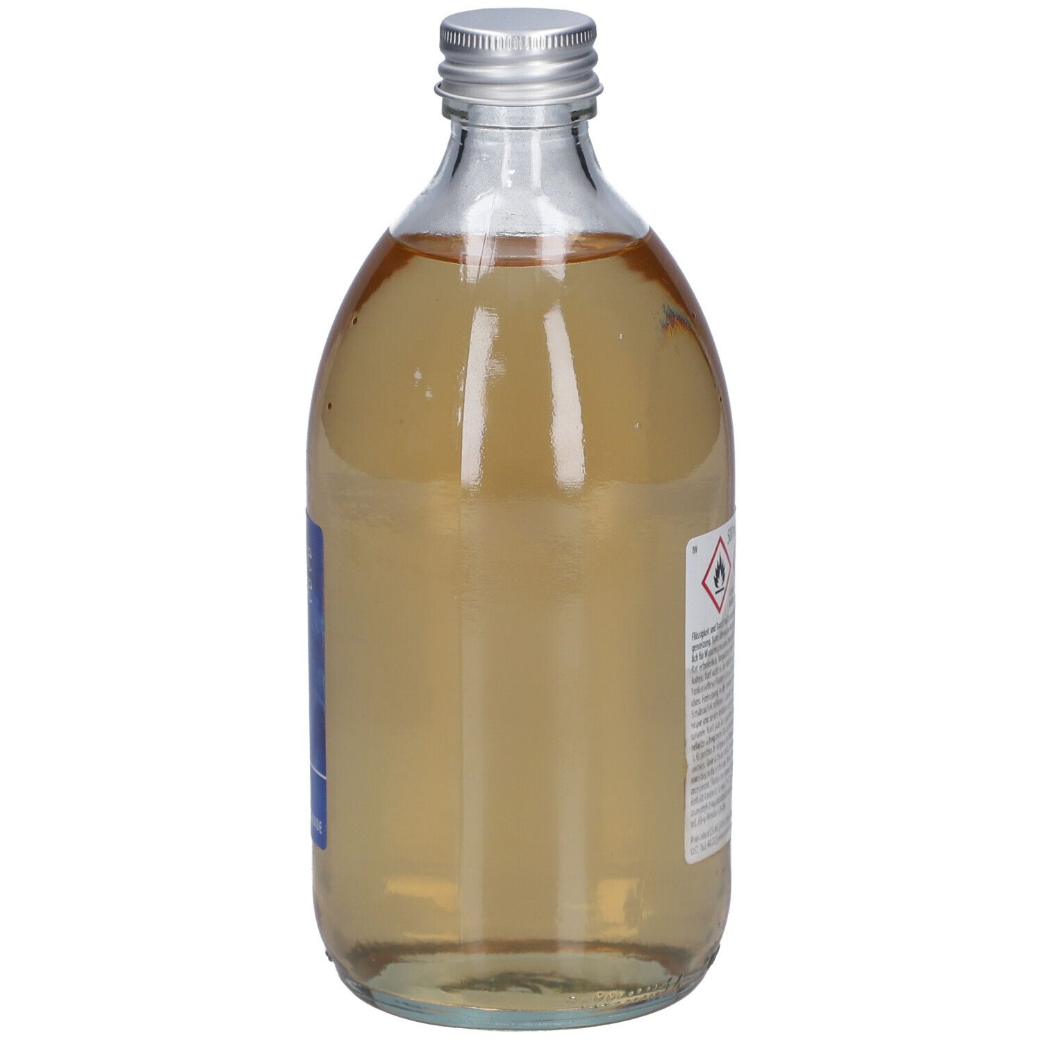 Flacon en verre avec bouchon argenté. Dos avec étiquette et avertissements. Liquide.