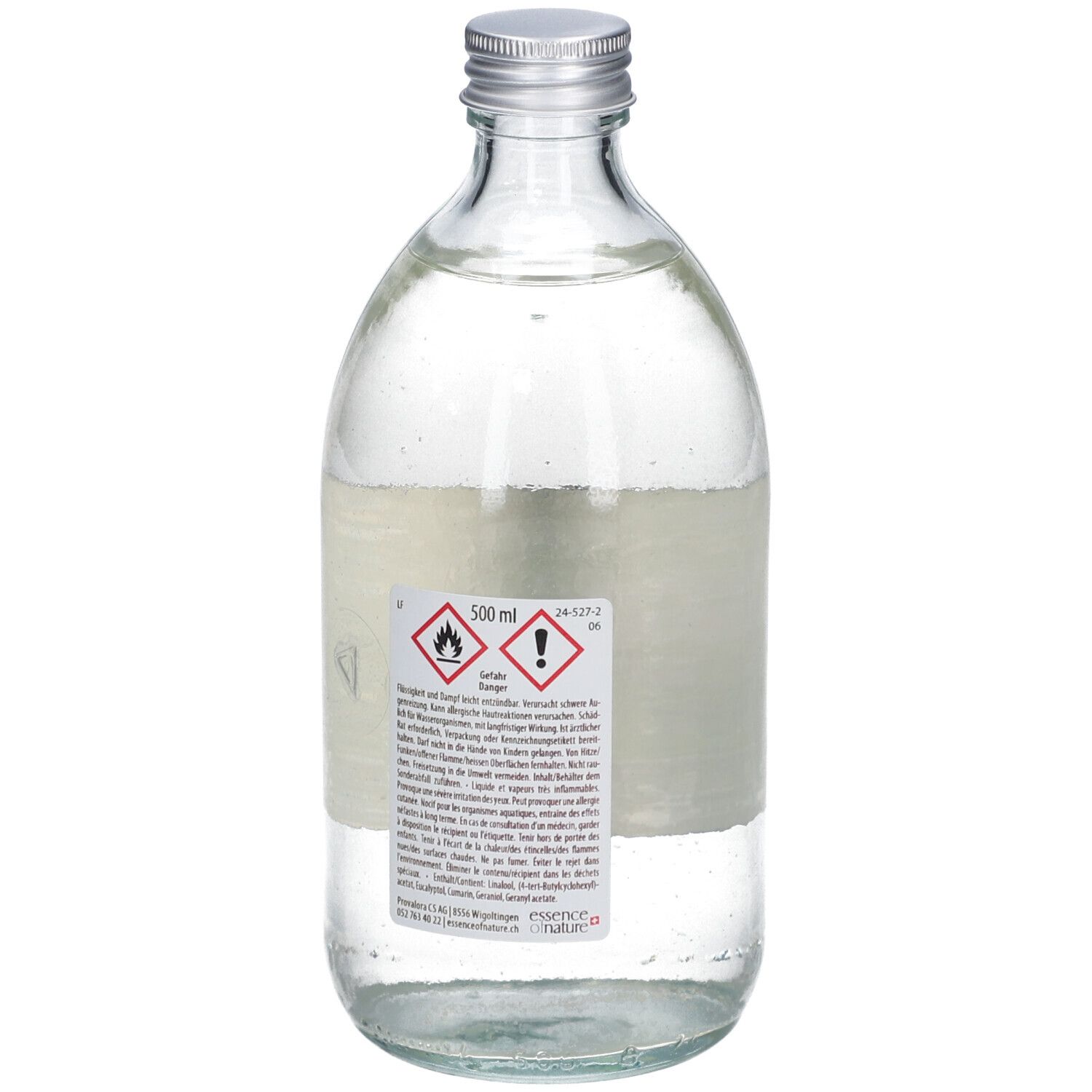 Flacon en verre avec bouchon argenté. Étiquette avec symboles d'avertissement et texte. Contient un liquide clair.