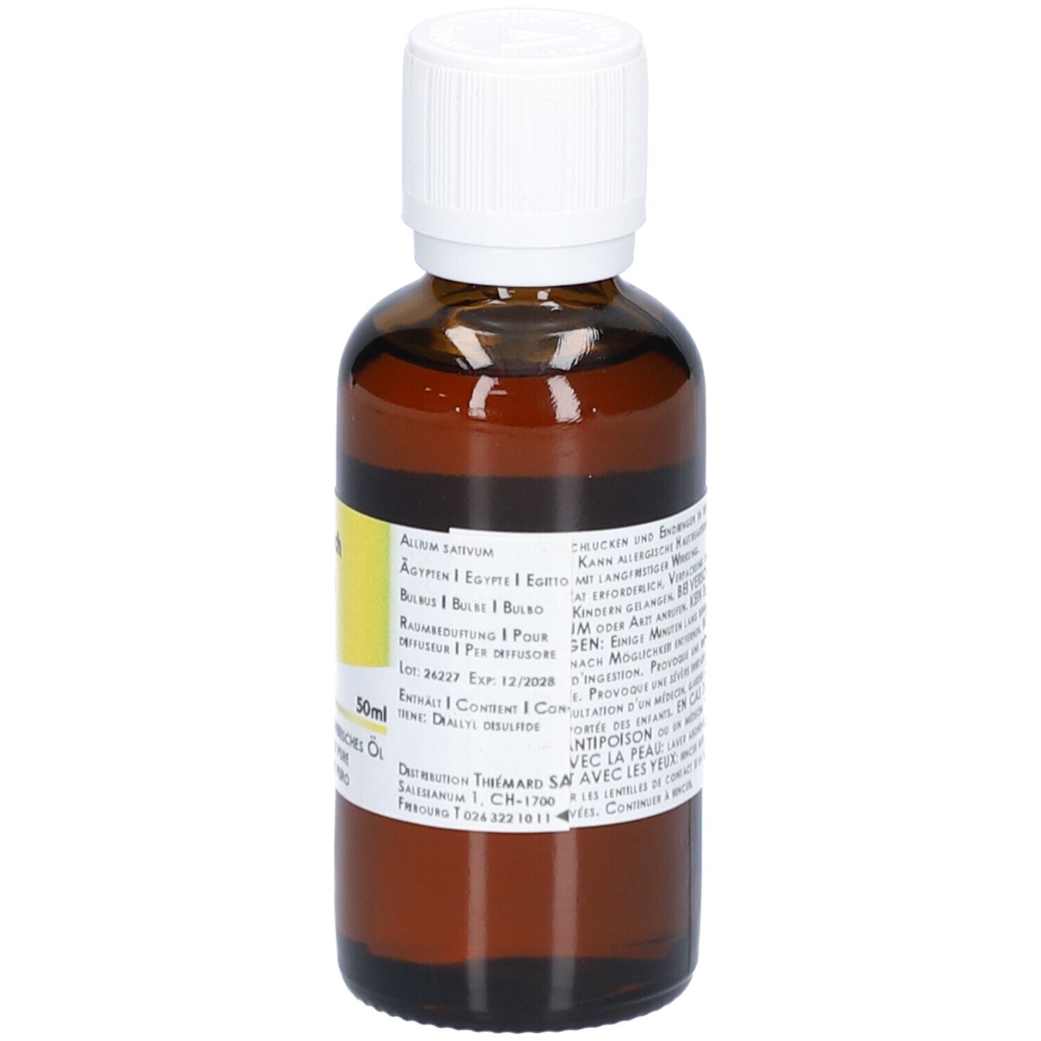 Flacon en verre brun avec bouchon blanc. Étiquette avec texte.