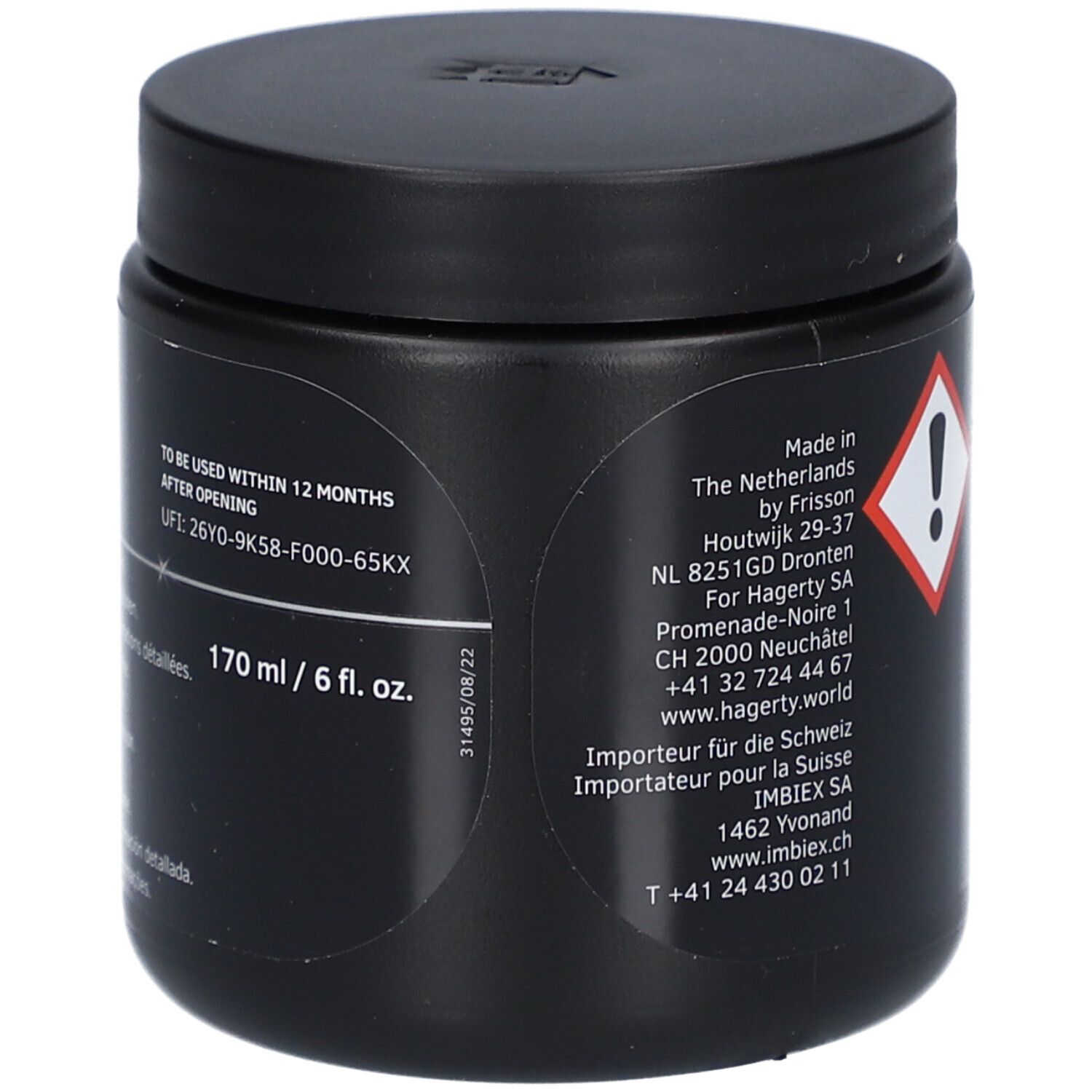 Boîte noire. Inscription: 170 ml / 6 fl. oz. Date de péremption. Adresse du fabricant.