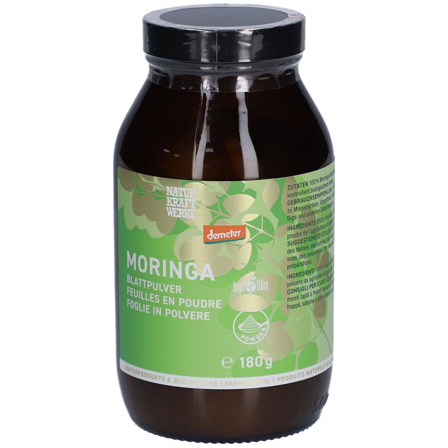 Flacon en verre brun avec couvercle noir. Étiquette verte avec motif de feuilles et texte: Moringa, feuilles en poudre, Demeter, 180g.