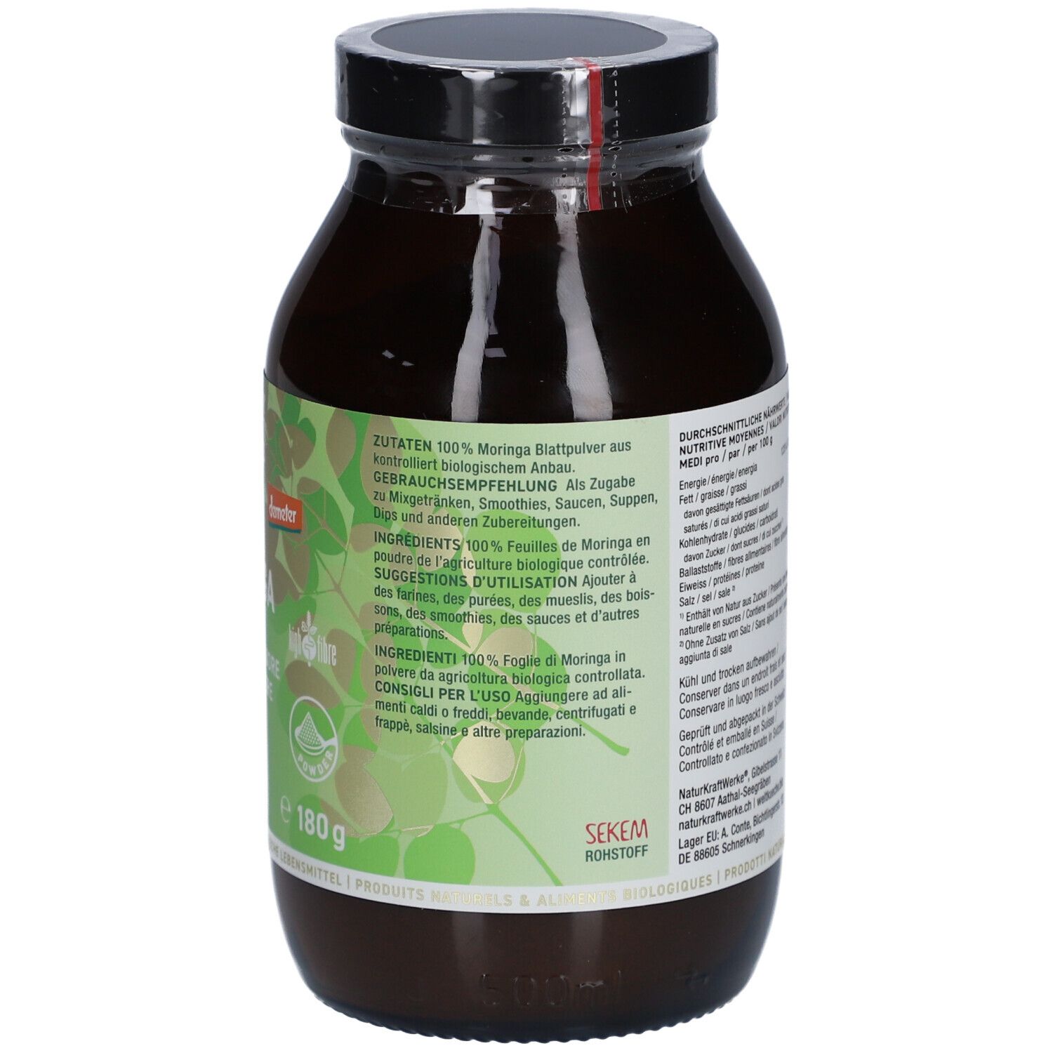 Flacon en verre brun avec couvercle noir. Dos avec étiquette, texte, informations nutritionnelles et ingrédients. Sceau Demeter, 180g.