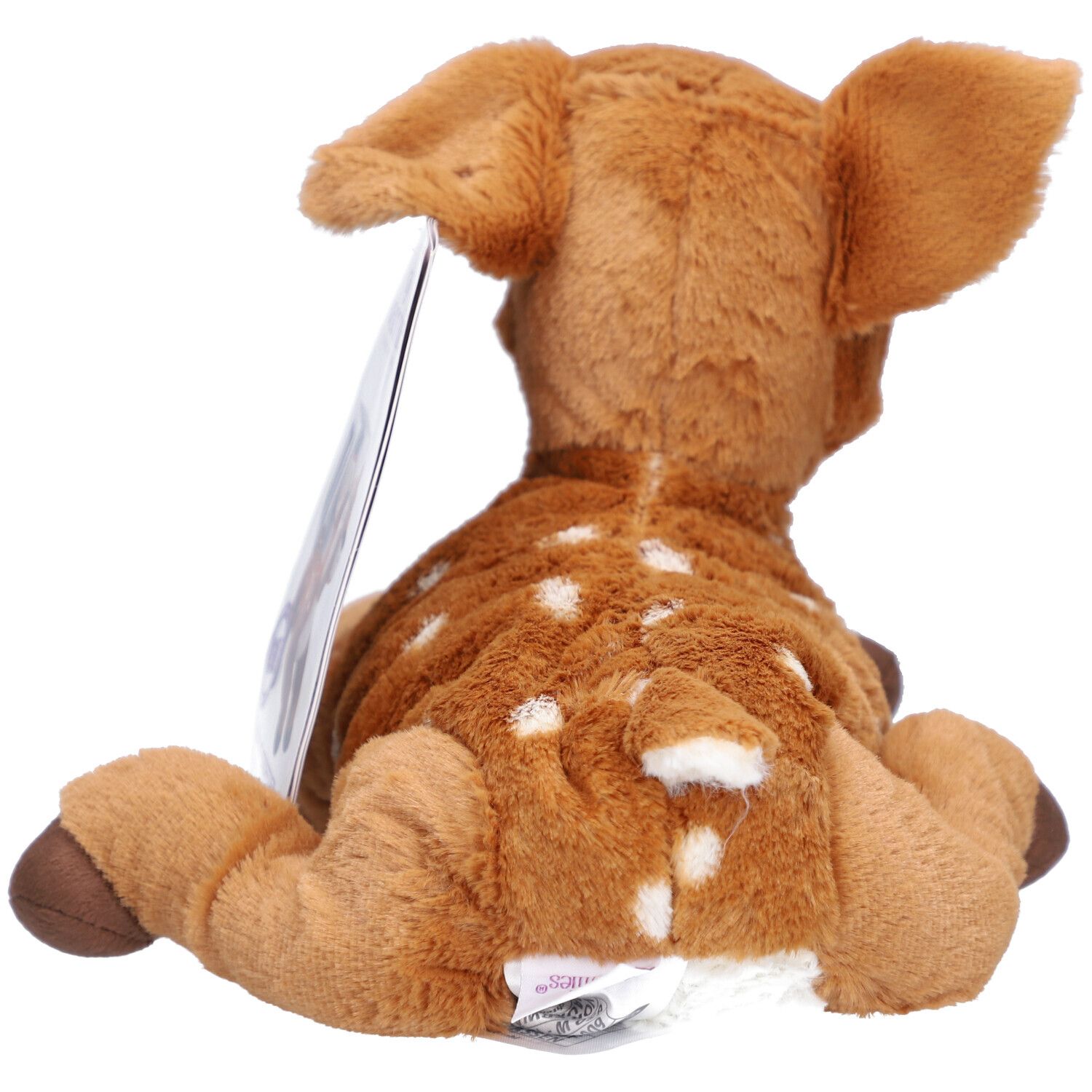Vue arrière d'un faon en peluche marron avec des taches blanches. Oreilles, ventre et pieds brun clair. Étiquette.