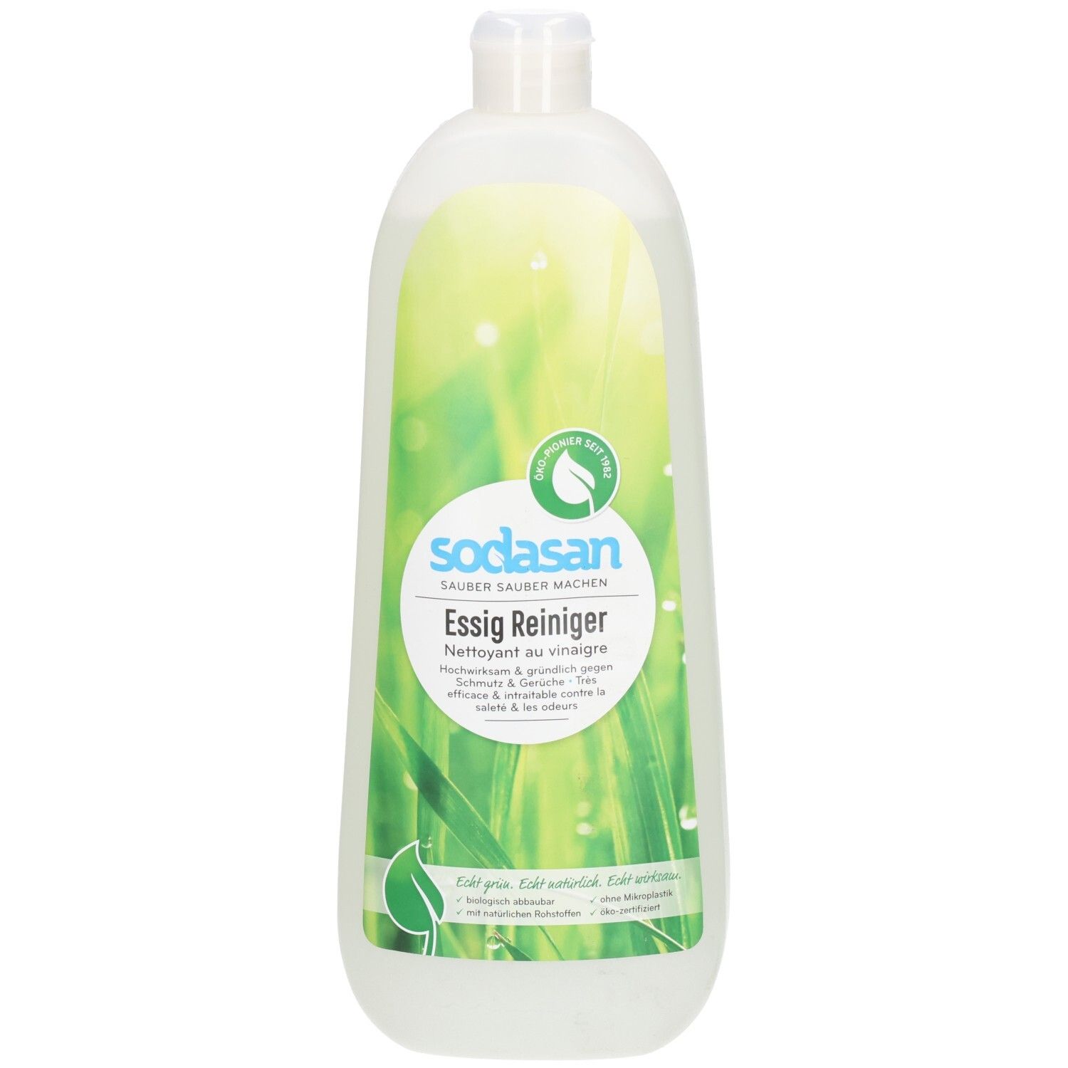 Bouteille de nettoyant au vinaigre Sodasan avec étiquette montrant de l'herbe et des gouttes d'eau.