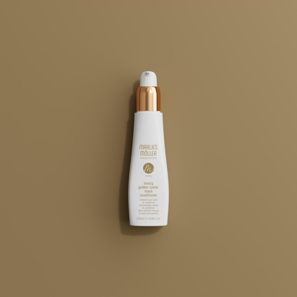 Flacon blanc avec bouchon doré. Inscription : Marlies Möller, Luxury Golden Caviar Mask Conditioner.
