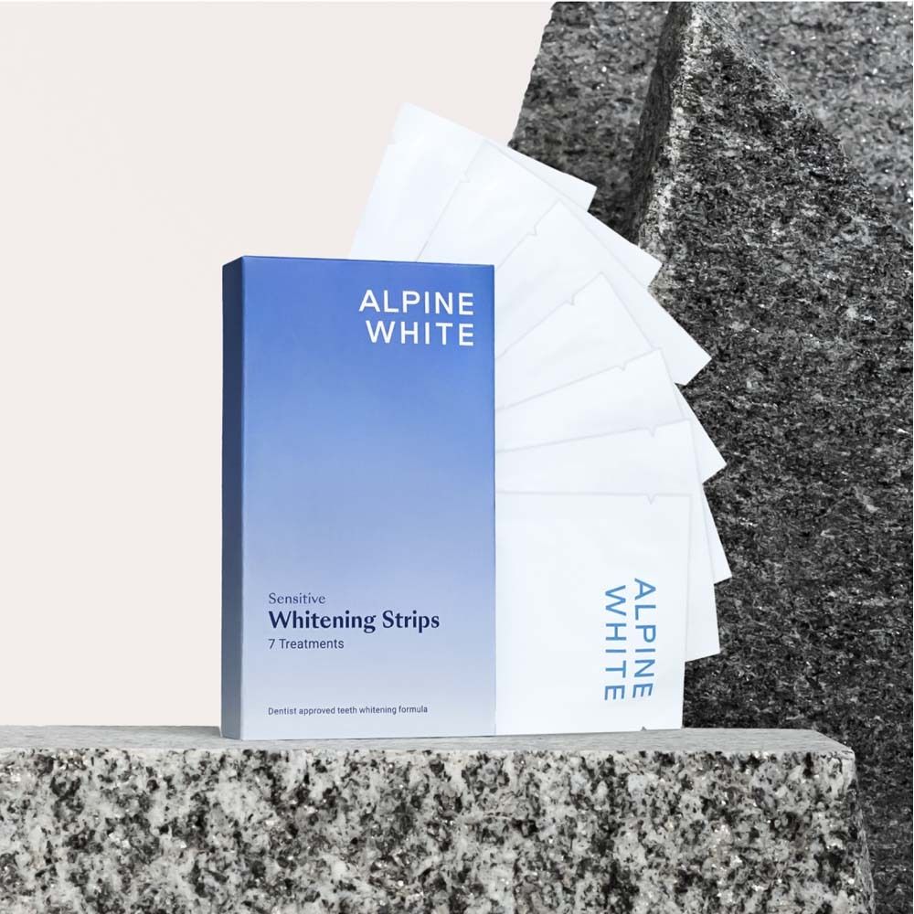 Boîte ALPINE WHITE, bandes blanchissantes sensibles. 7 traitements. Posée sur une pierre.