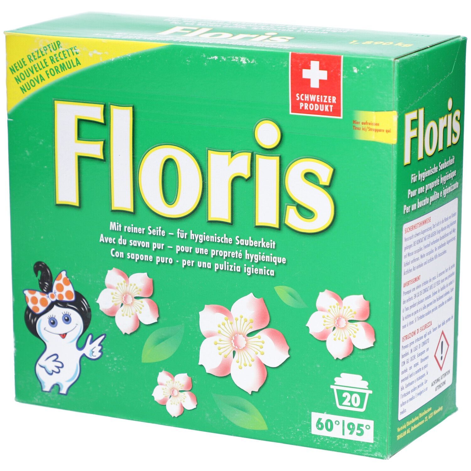 Boîte verte avec logo "Floris", fleurs et personnage de dessin animé. Texte en allemand, français, italien. Produit suisse.