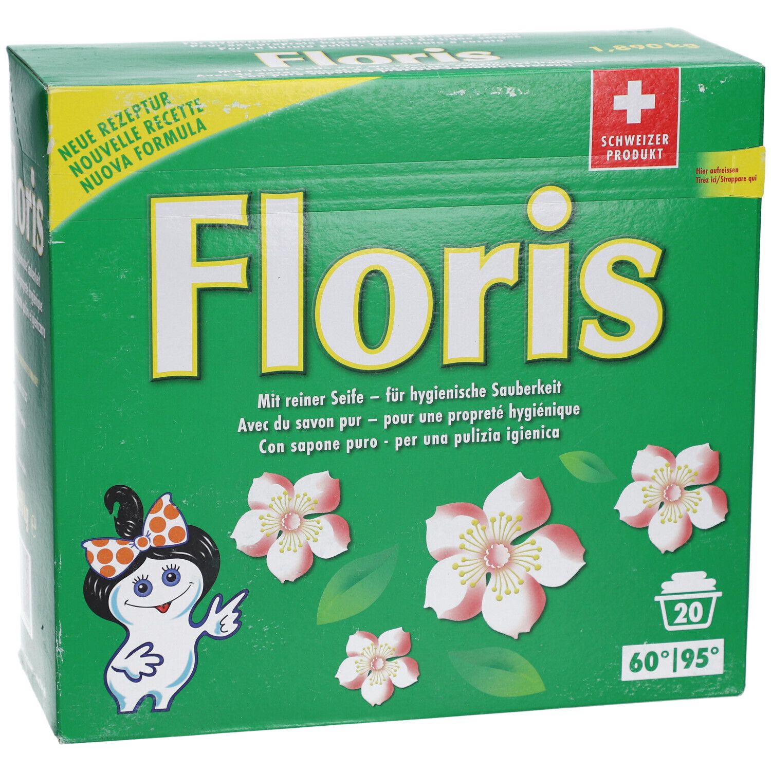 Boîte verte avec logo "Floris", fleurs et personnage de dessin animé. Texte en allemand, français, italien. 20 lavages.