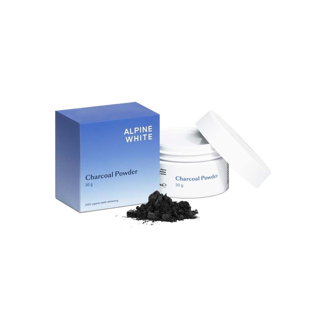 Boîte et pot bleus avec poudre noire. Texte: ALPINE WHITE, Charcoal Powder, 30 g.