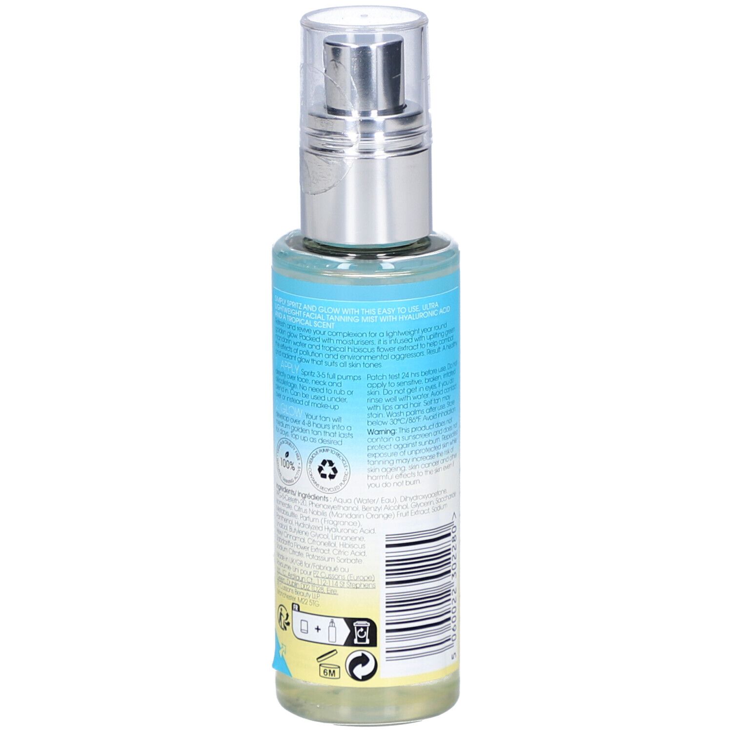 Dos du flacon. Étiquette avec informations produit, ingrédients et symboles. Inscription: ST. TROPEZ. Flacon avec vaporisateur.