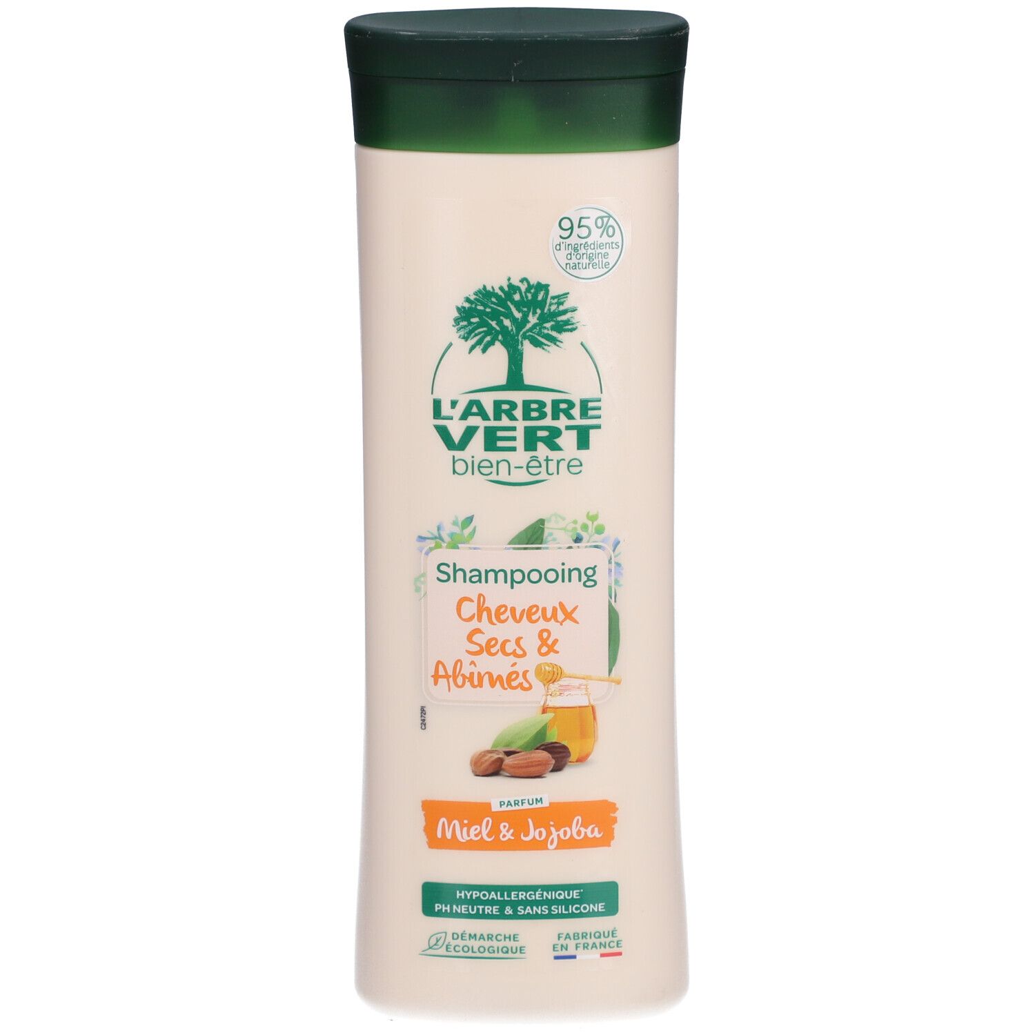 Flacon de shampooing beige, bouchon vert. Logo L'ARBRE VERT. Texte: Shampooing Cheveux Secs & Abîmés. Miel & Jojoba. Produit écologique.