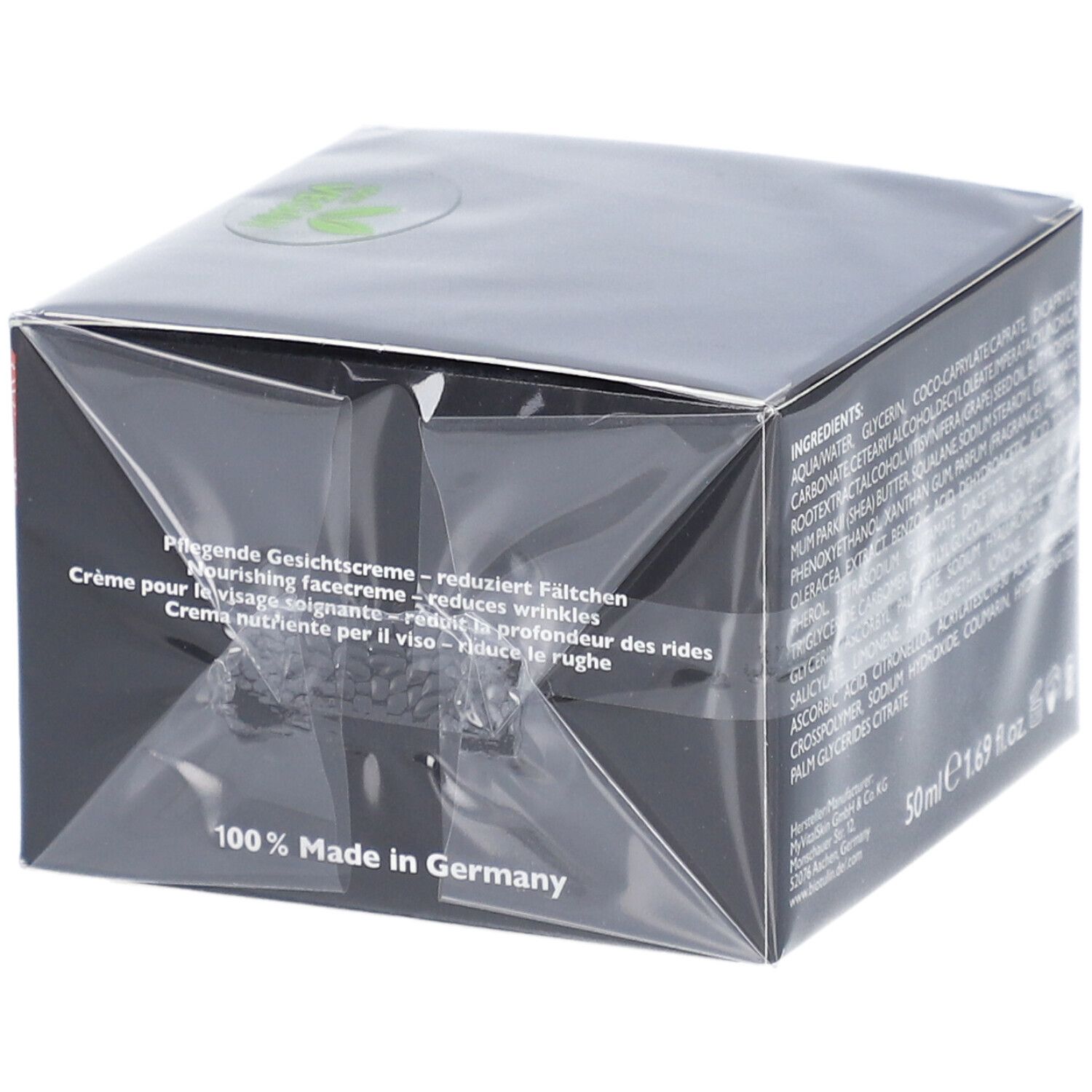 Boîte noire avec informations produit. 50 ml. Fabriqué en Allemagne. Logo vegan.