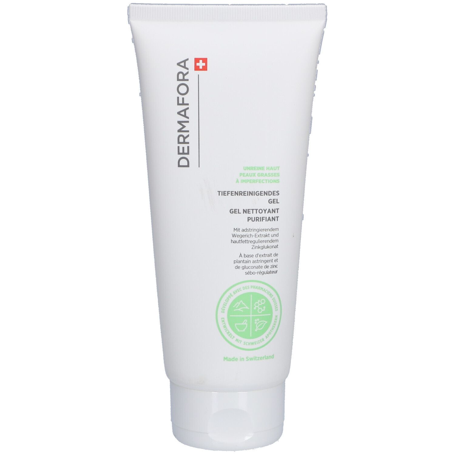 Tube blanche avec étiquette verte. Inscription: DERMAFORA, Gel nettoyant purifiant. Croix suisse. Extraits végétaux.