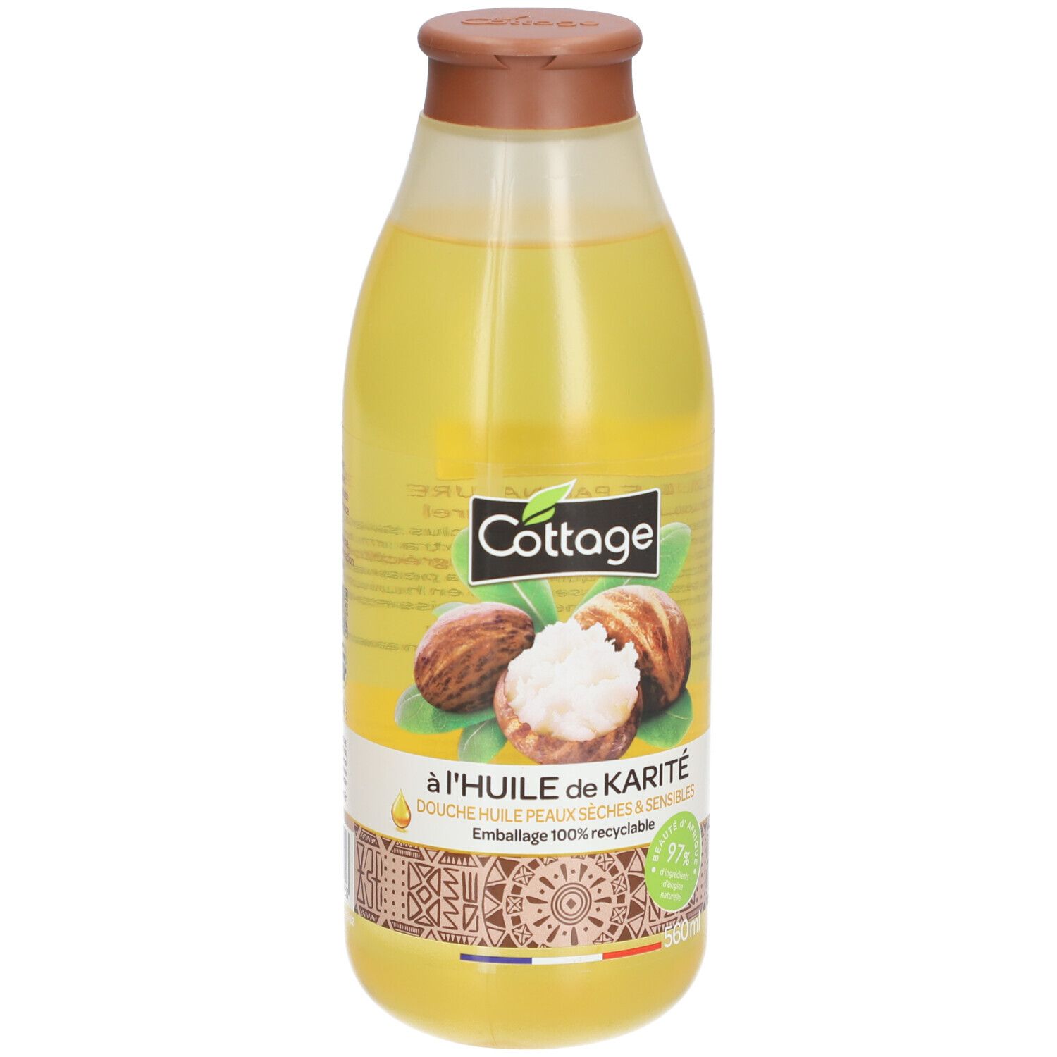 Bouteille de gel douche Cottage au beurre de karité, liquide jaune, bouchon marron.