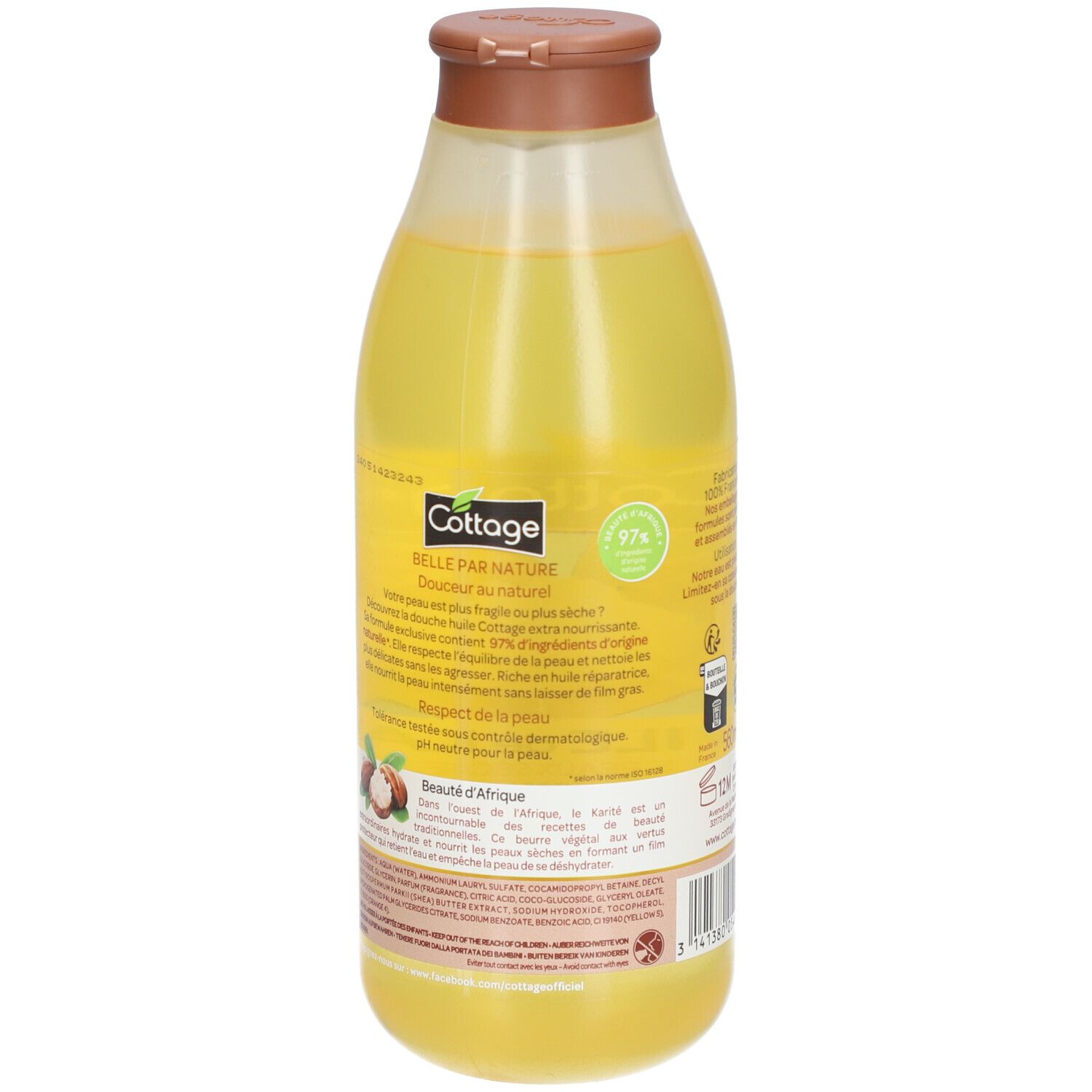 Huile de douche Cottage avec 97% d'ingrédients d'origine naturelle dans une bouteille transparente avec bouchon marron.