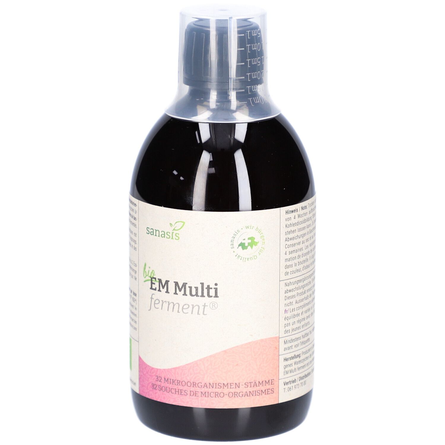Liquide brun en bouteille avec étiquette. Inscription: bio EM Multi ferment. Avec label bio.