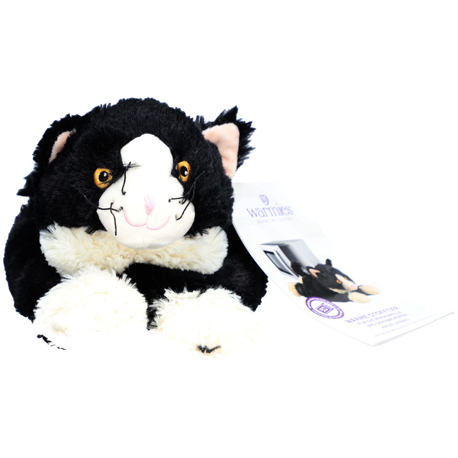 Chat en peluche noir et blanc avec étiquette. L'étiquette indique "Warmies".