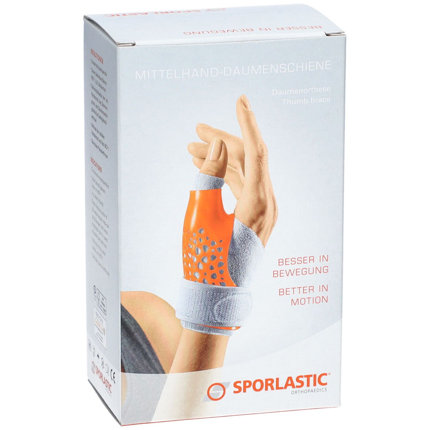 Boîte de l'attelle de pouce. Attelle orange et grise sur une main. Marque : SPORLASTIC.