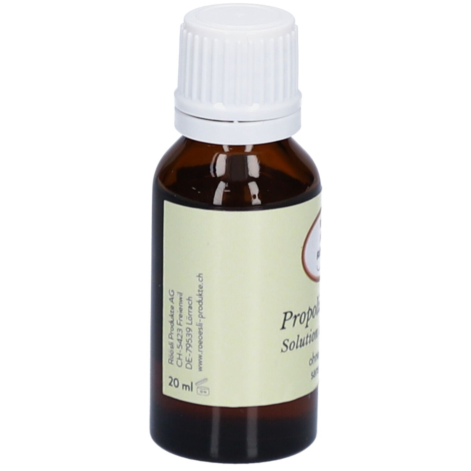 Flacon en verre brun avec bouchon blanc. Étiquette avec nom du produit, marque RÖÖSLI, sans alcool et adresse du fabricant.