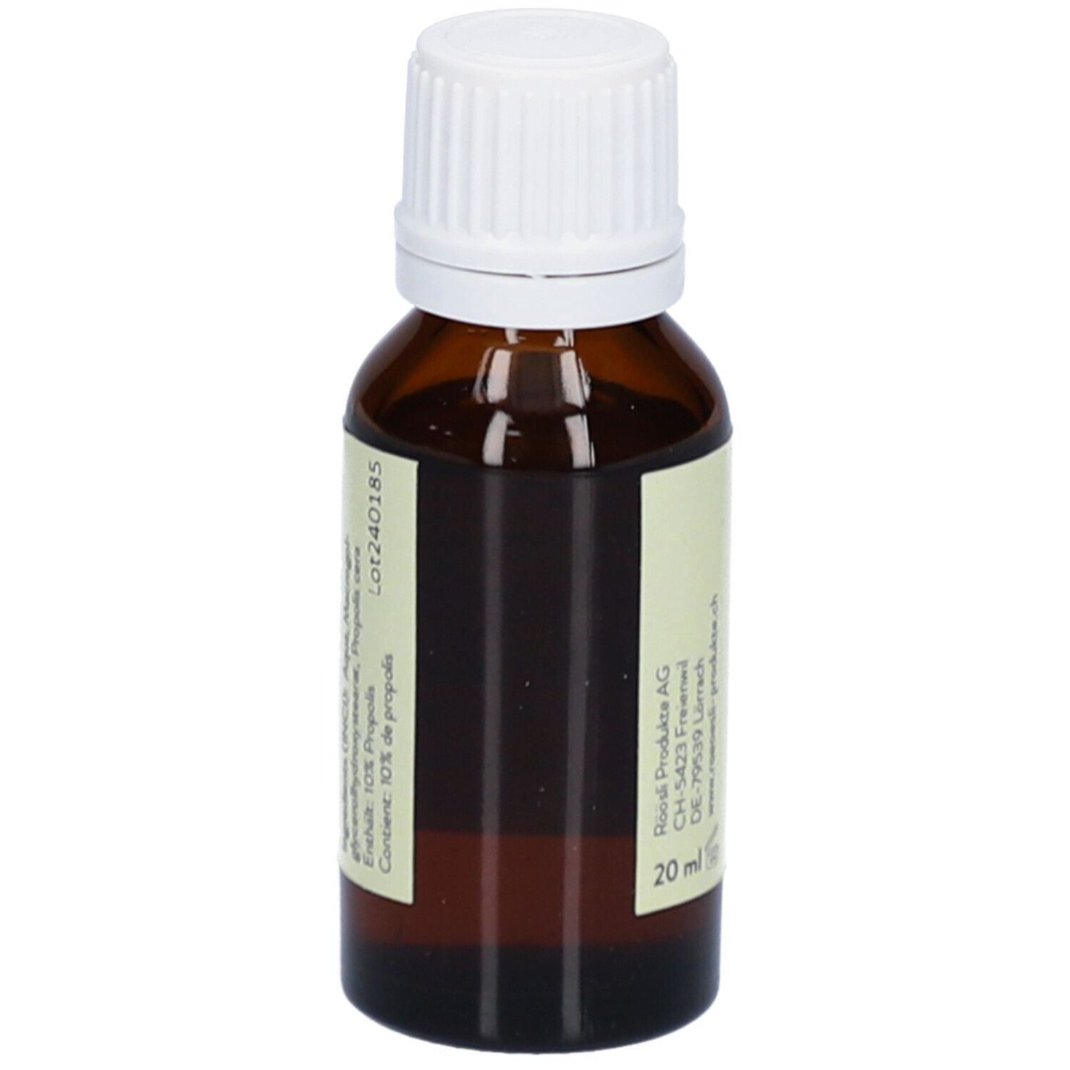 Flacon en verre brun avec bouchon blanc. Étiquette avec nom du produit, marque RÖÖSLI, sans alcool, adresse fabricant et 20 ml.