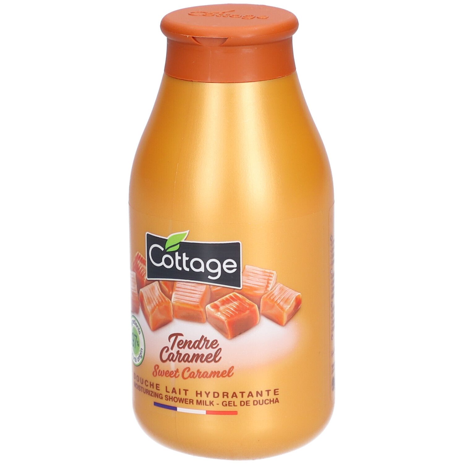 Flacon doré avec bouchon marron. Inscription: Cottage, Tendre Caramel, 97% d'origine naturelle. Illustration de bonbons au caramel.