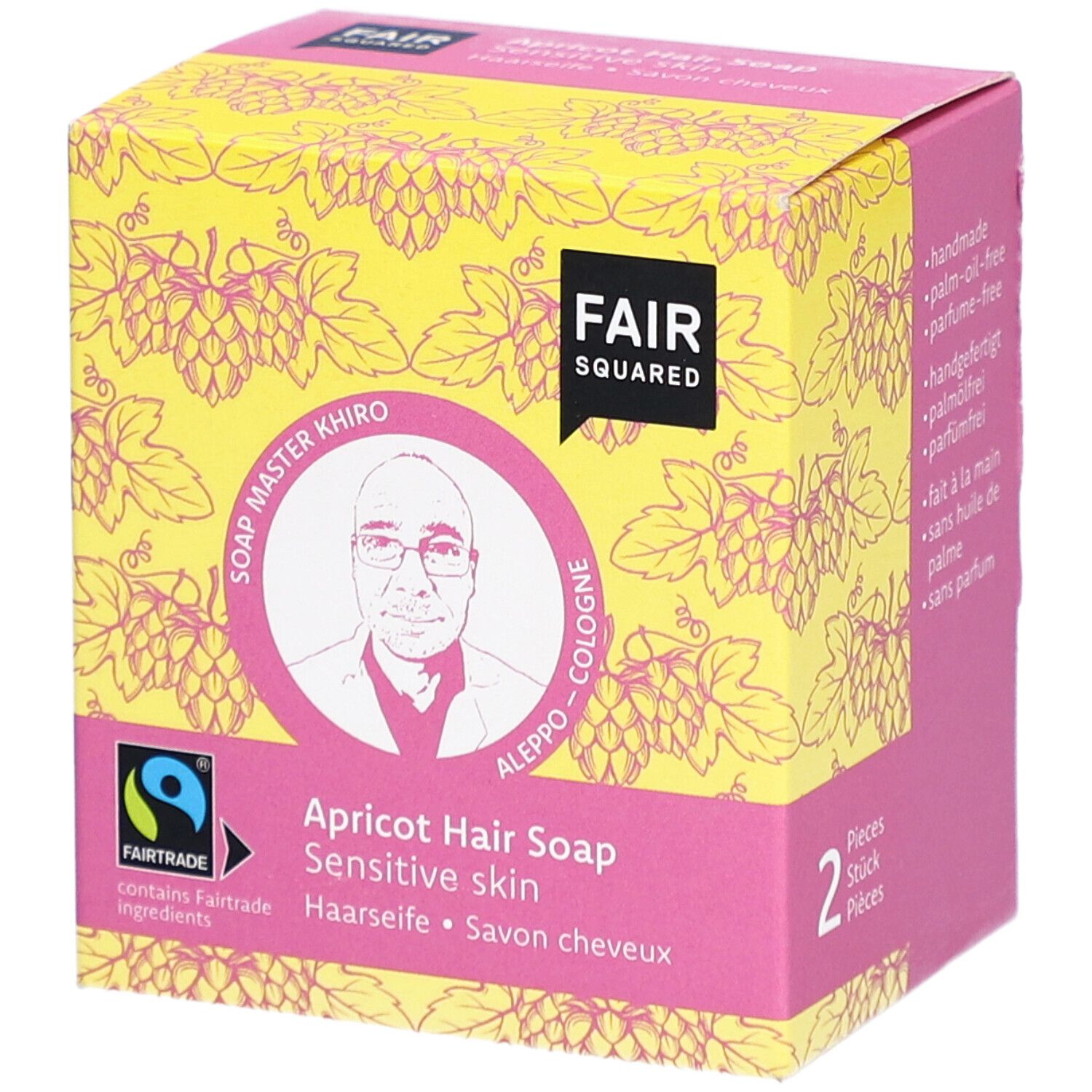 Emballage de savon capillaire à l'abricot. Logo FAIR SQUARED, label FAIRTRADE, image de Soap Master Khiro. Inscription: Haarseife, Savon cheveux.