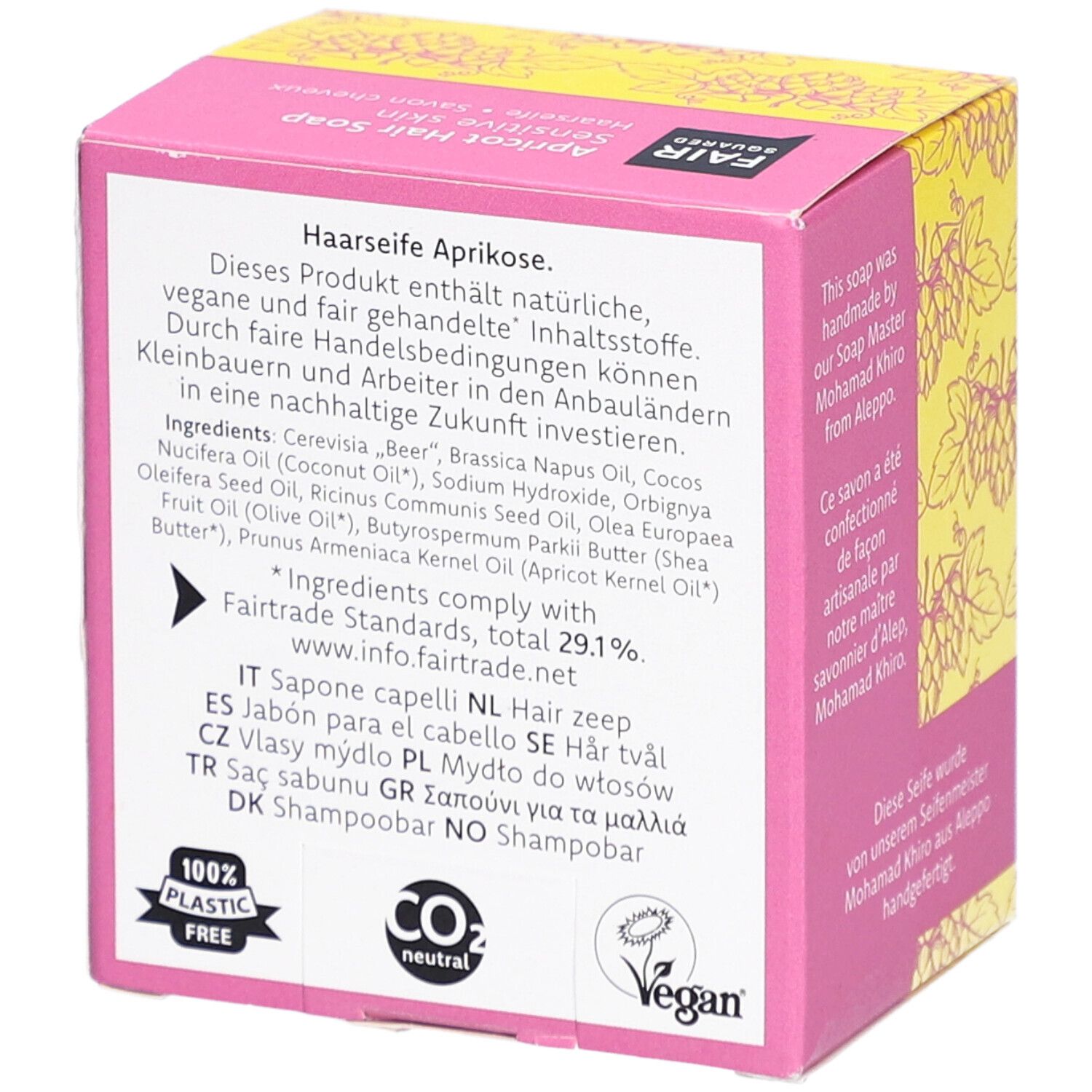 Dos de l'emballage. Texte: ingrédients, vegan, neutre en CO2, 100% sans plastique. Label FAIRTRADE. Label Vegan. Informations multilingues.