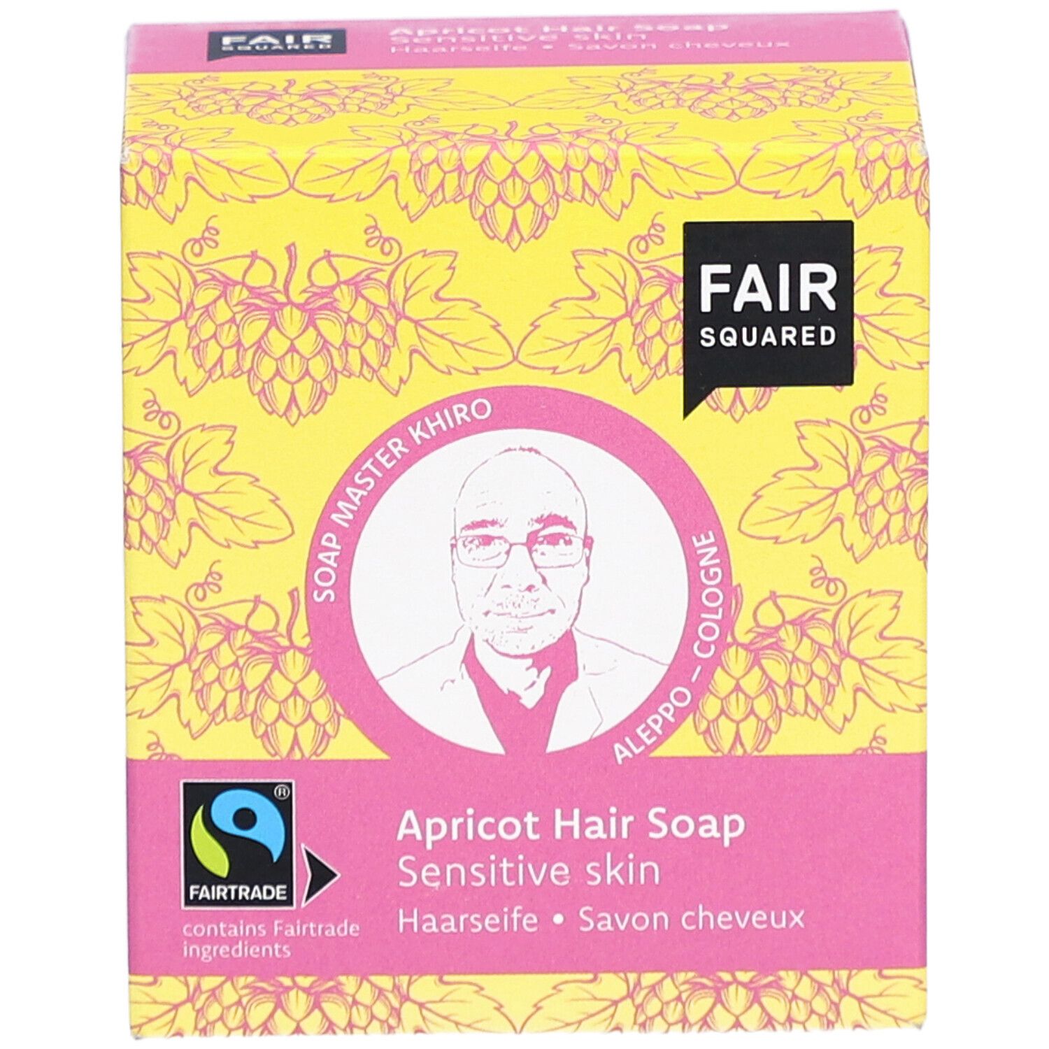 Emballage de savon capillaire à l'abricot. Logo FAIR SQUARED, label FAIRTRADE, image de Soap Master Khiro. Inscription: Haarseife, Savon cheveux.