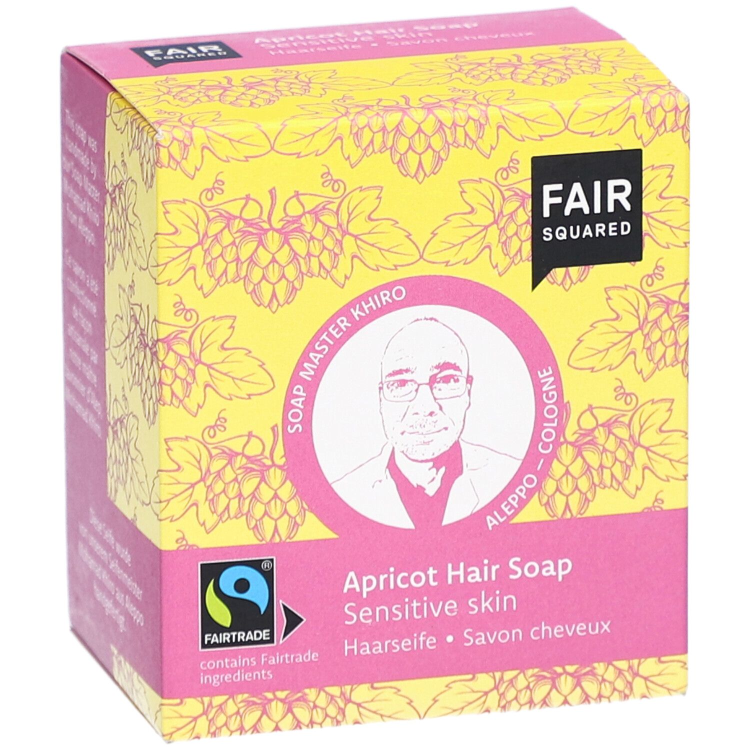 Emballage de savon capillaire à l'abricot. Logo FAIR SQUARED, label FAIRTRADE, image de Soap Master Khiro. Inscription: Haarseife, Savon cheveux.